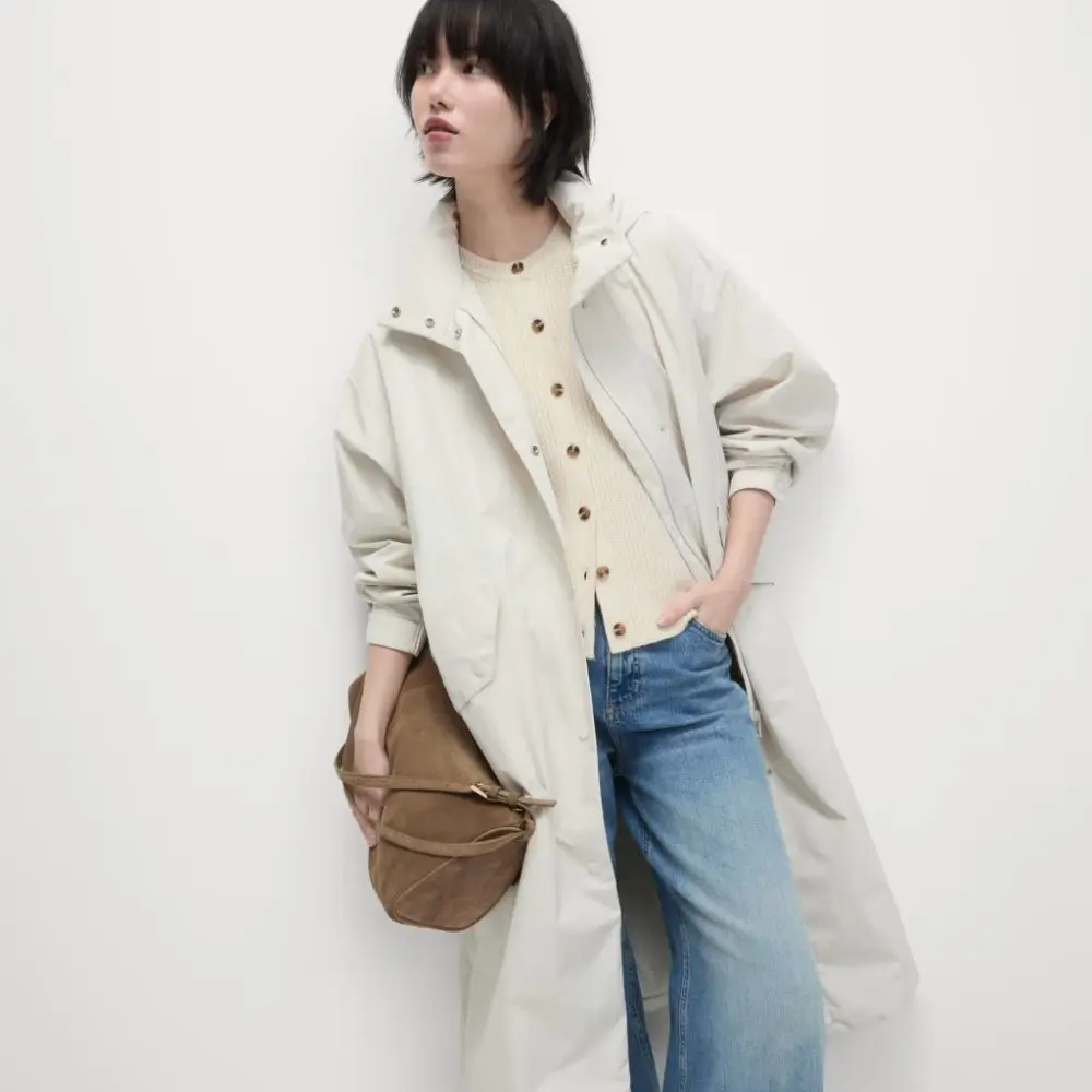 A woman wearing a white pa