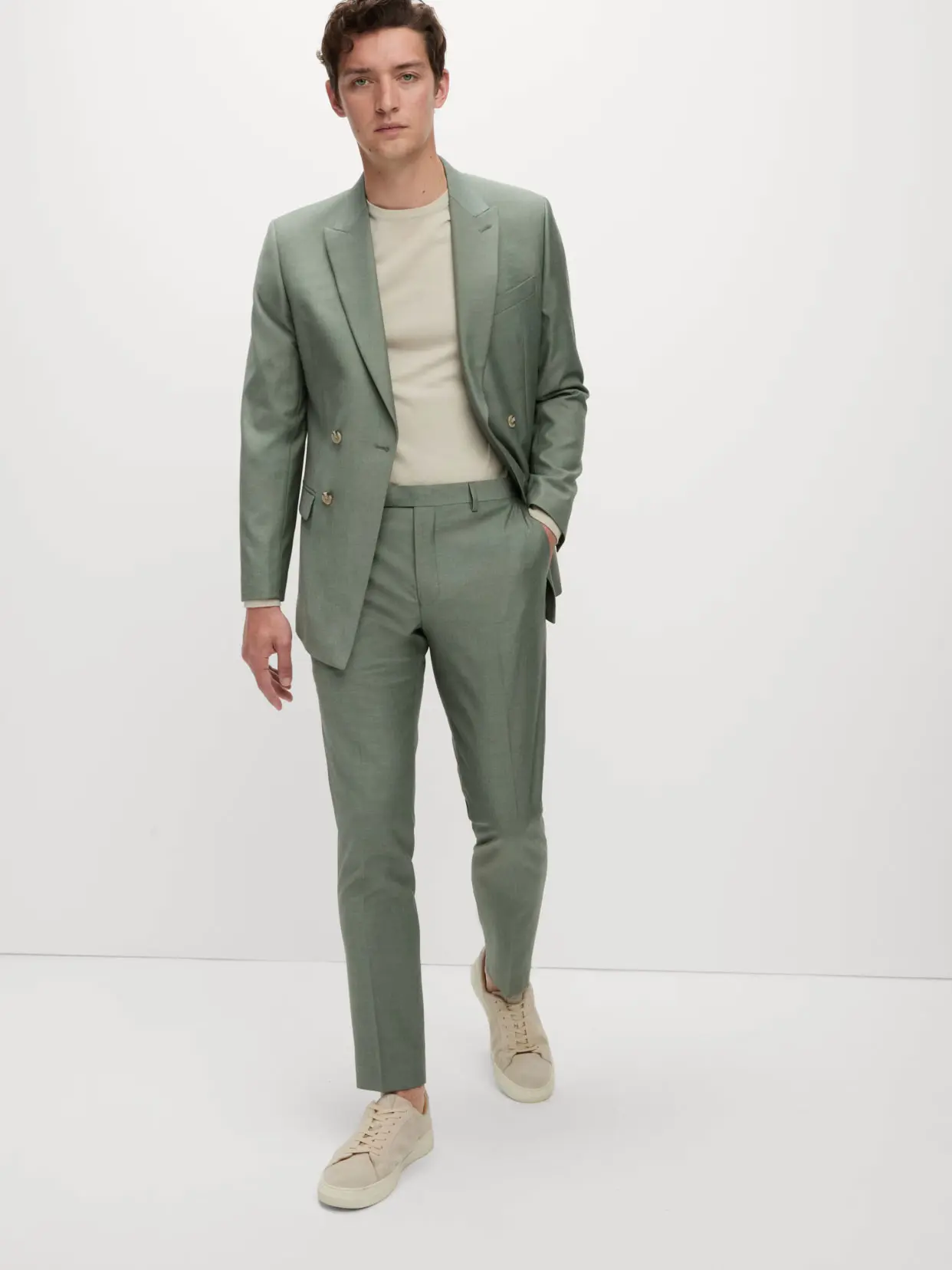 Man wearing green suit