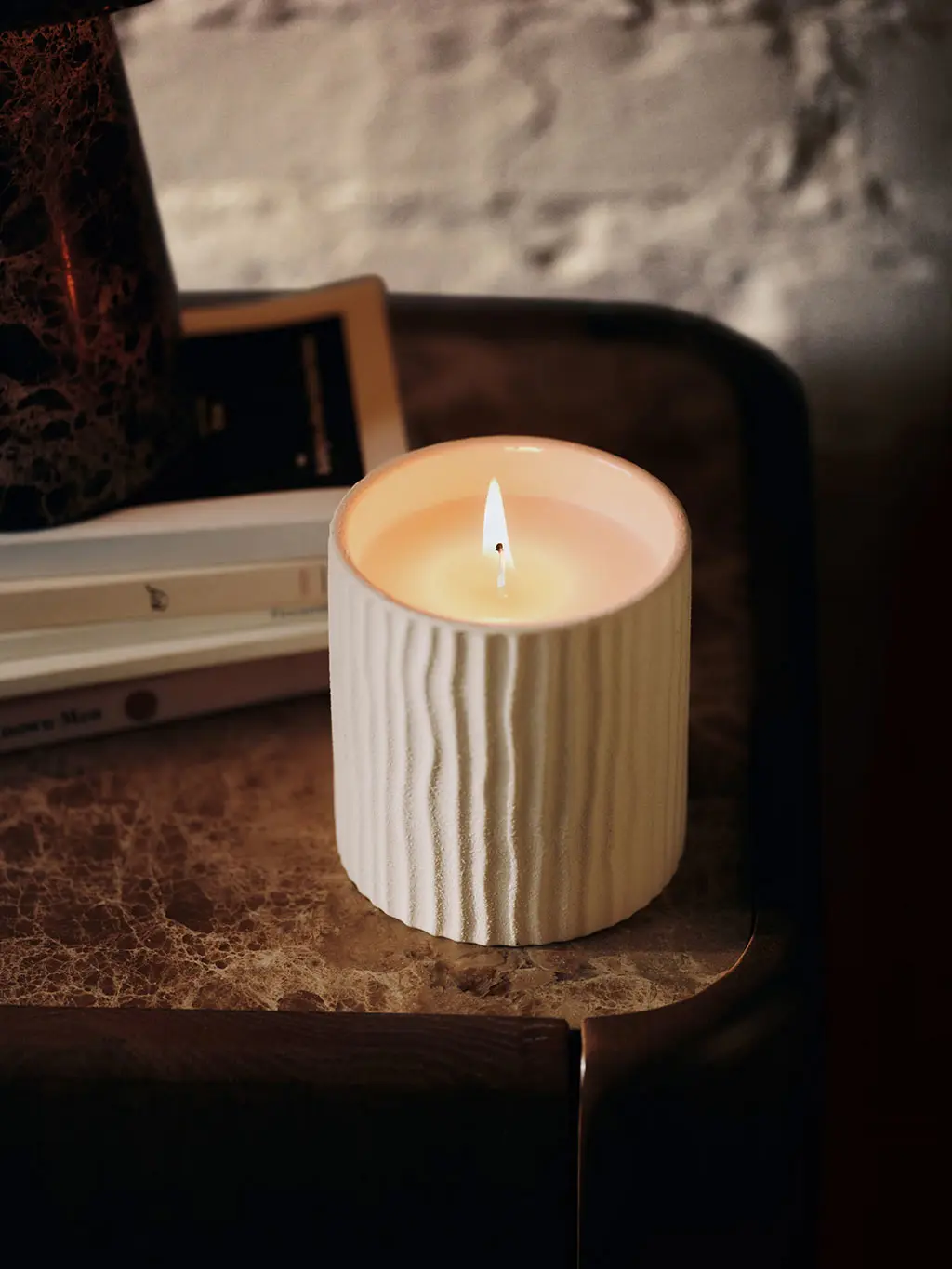 Scented candle in ceramic jar