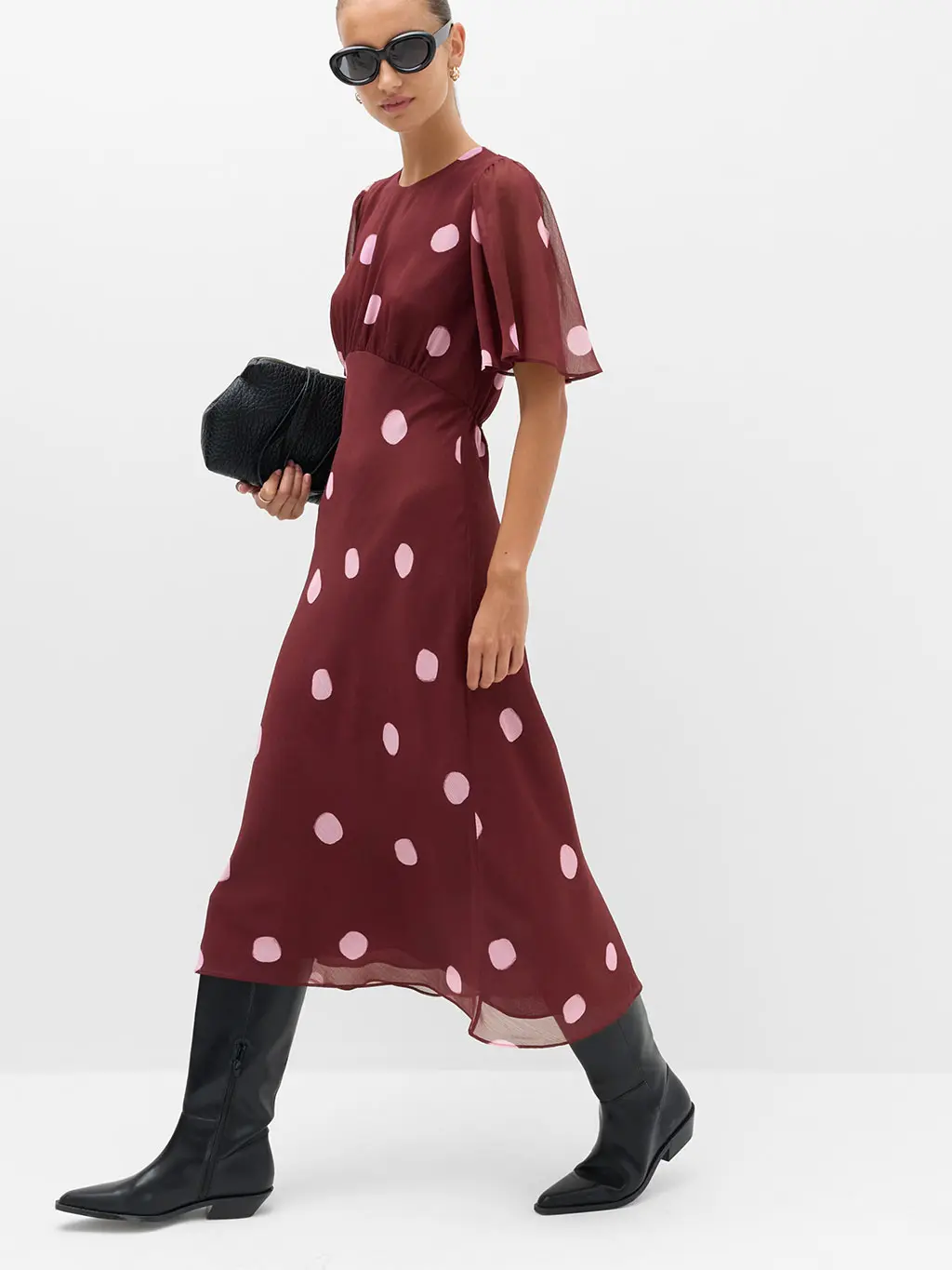 Woman in red dress and boots