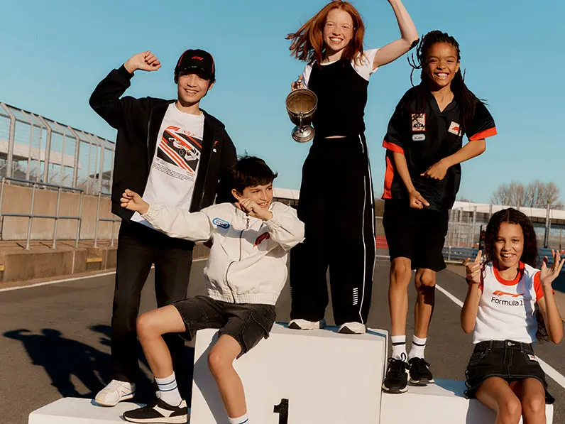 Kids on winners platform at race track