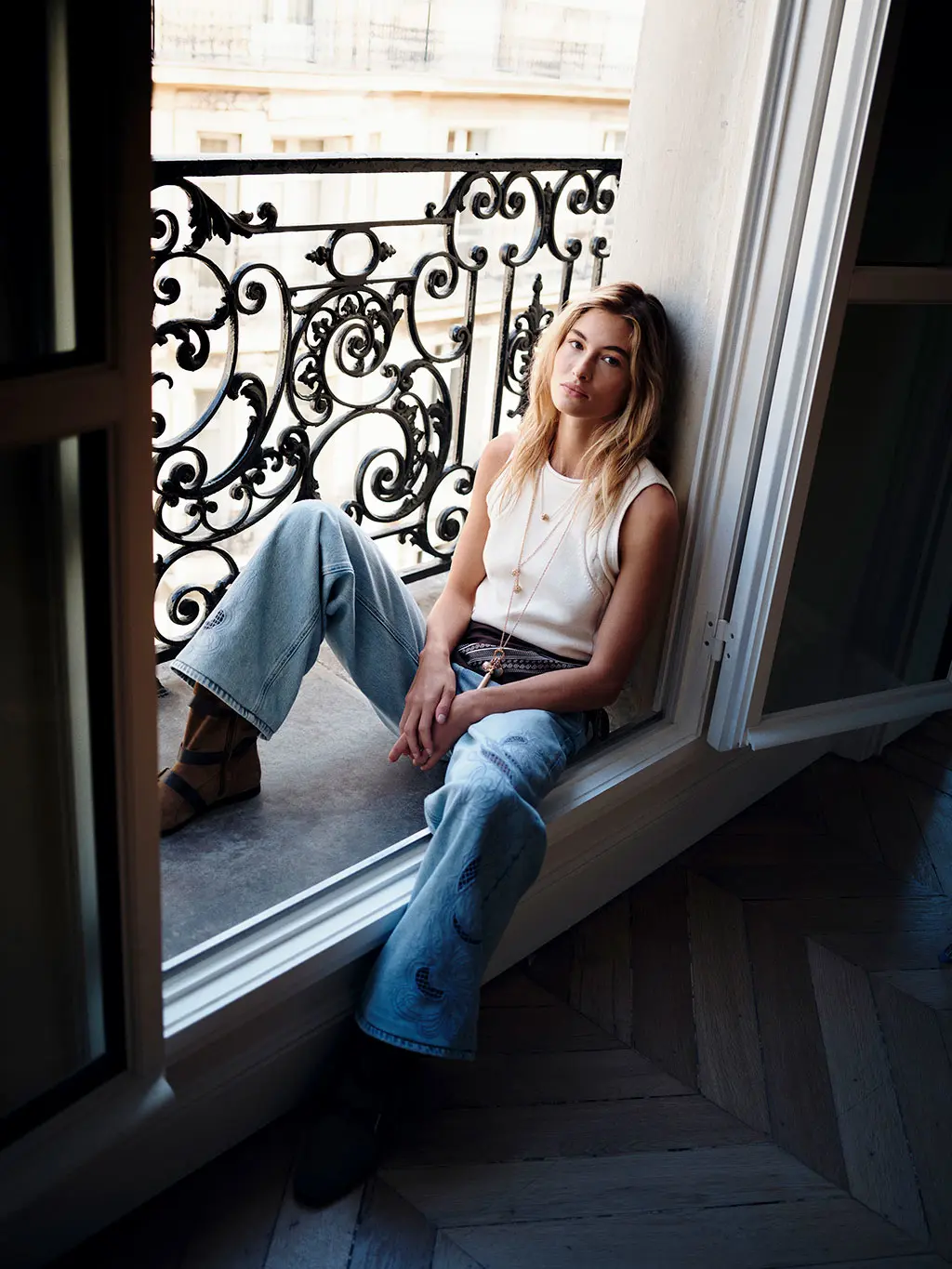 Woman in jeans and white knit top