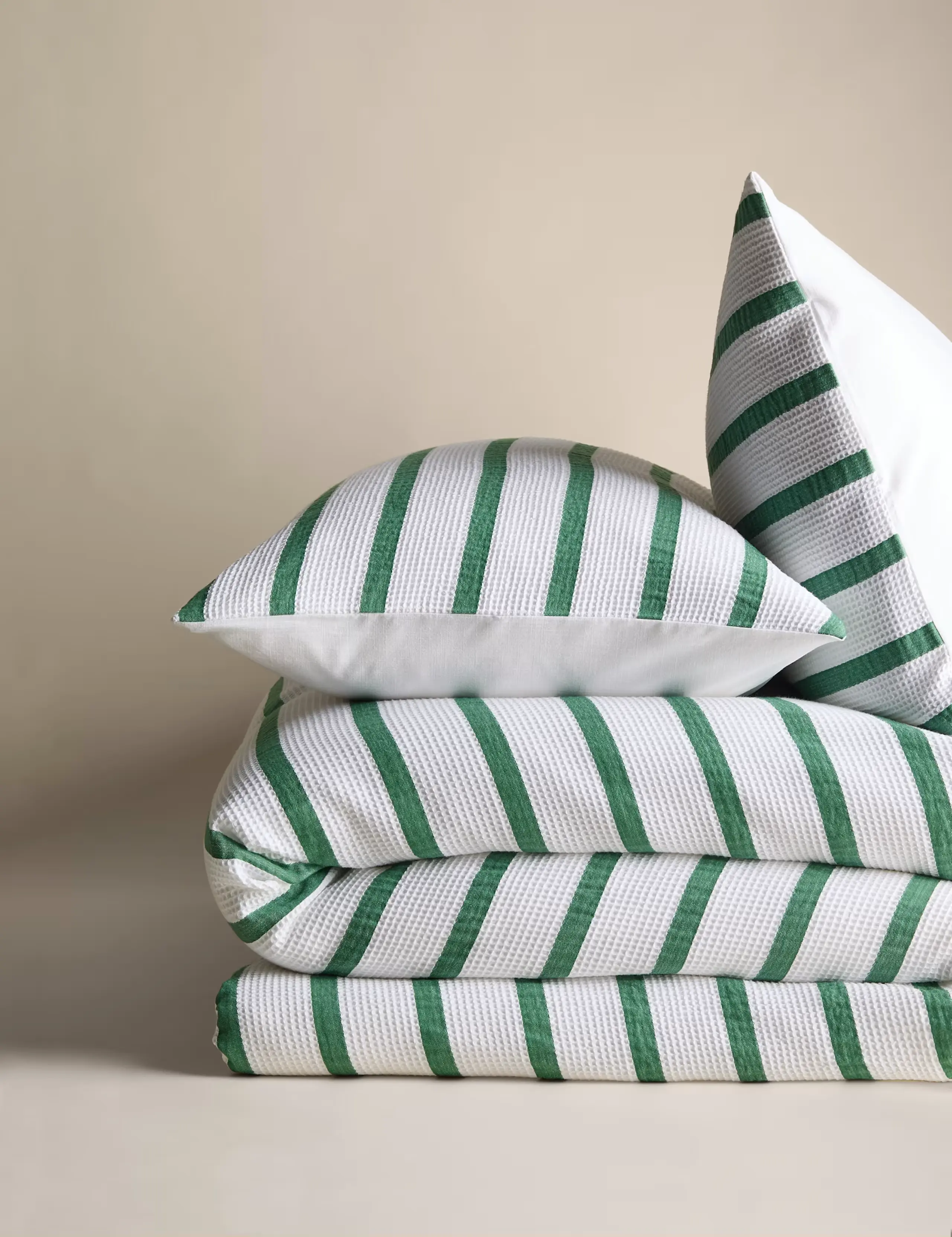 Green and white striped bedding