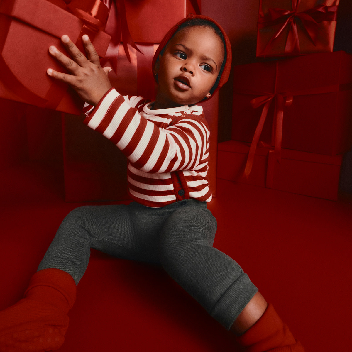 Boy in red and green outfit