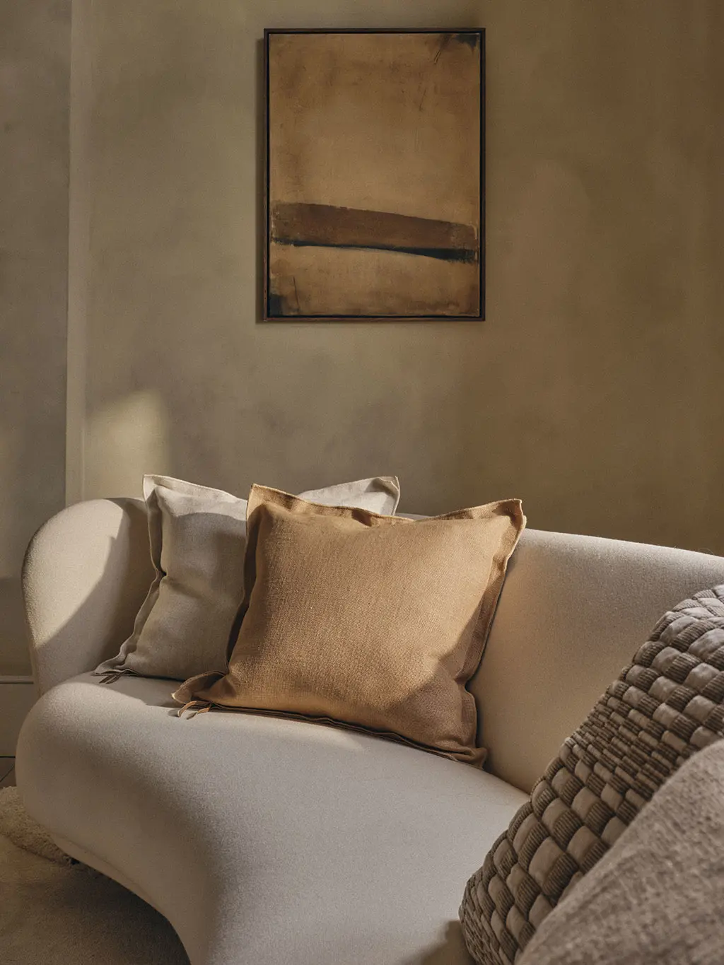 Beige sofa with neutral pillows