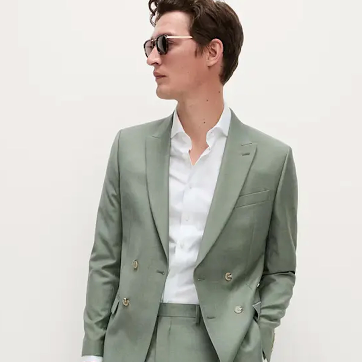Man wearing green suit