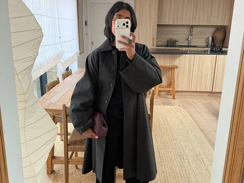 Monikh in grey overcoat