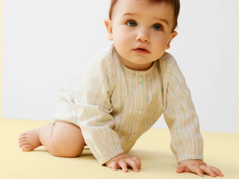 Baby wearing babygrow 