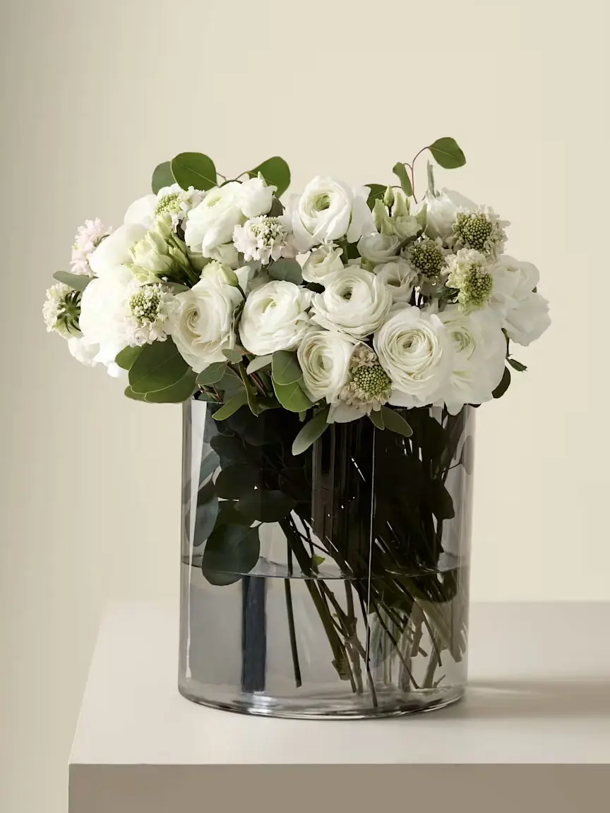 Bouquet of white flowers in glass vase