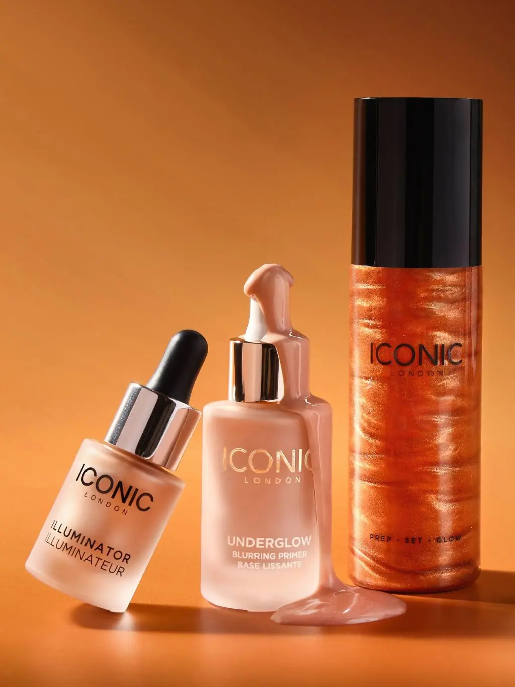 A range of Iconic London face products shot against an orange background