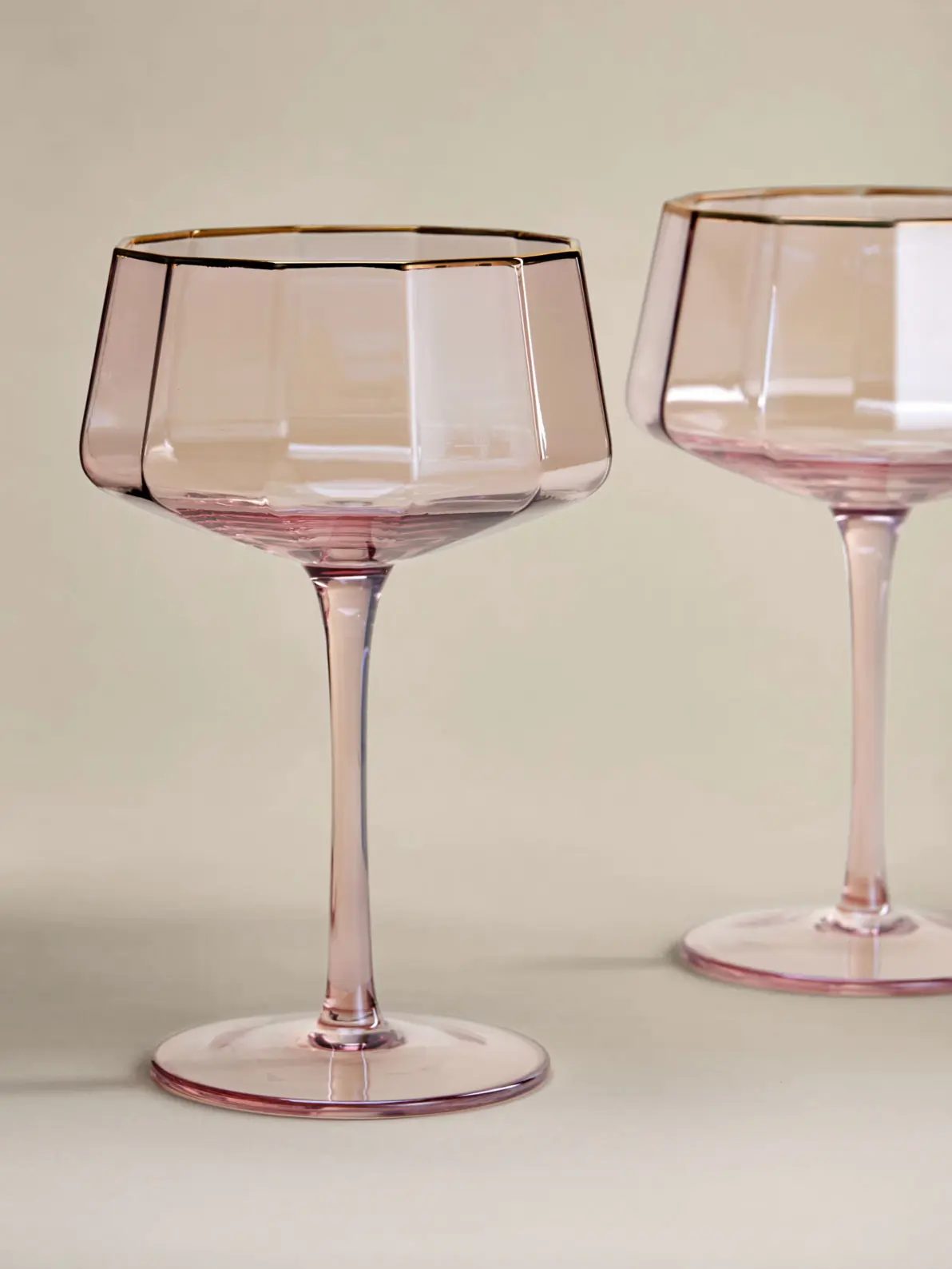 Image of pink pearlescent wine glasses with gold rim