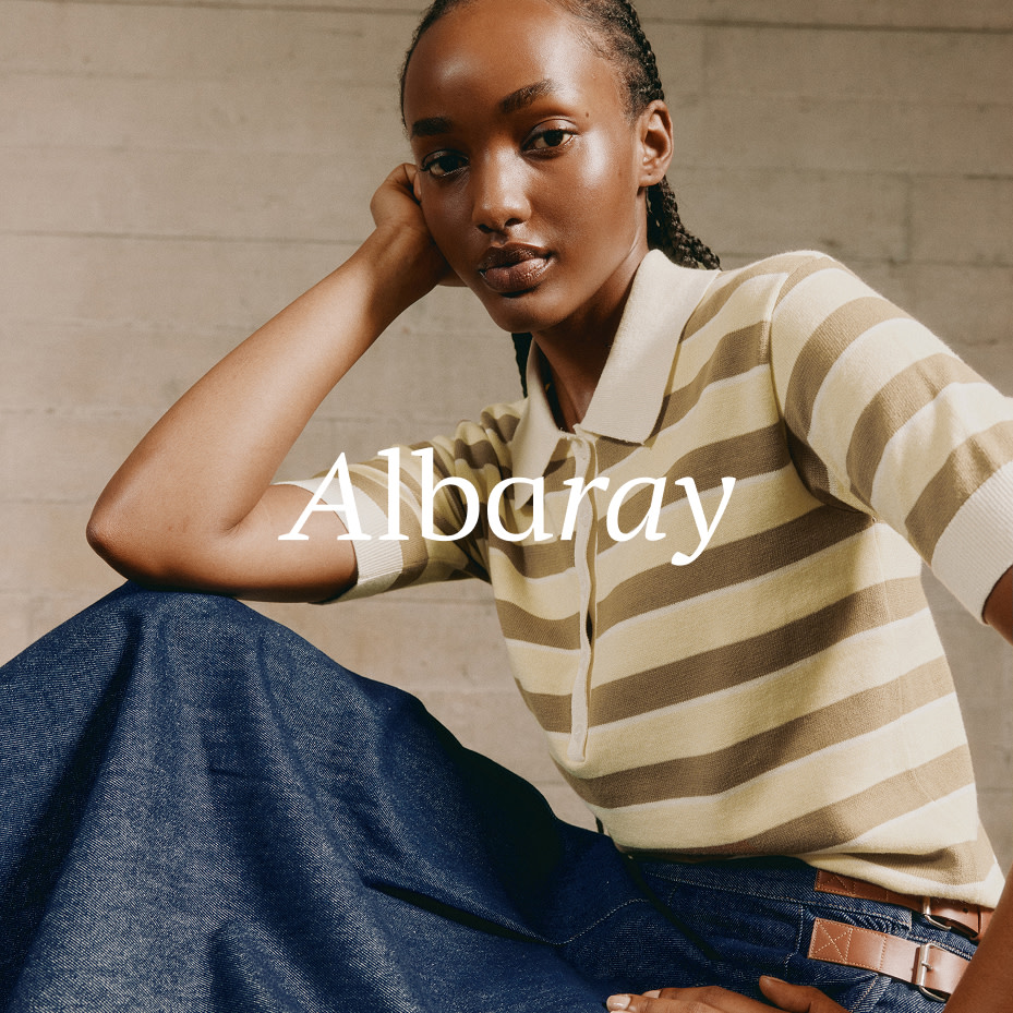Woman wearing Albaray striped polo top