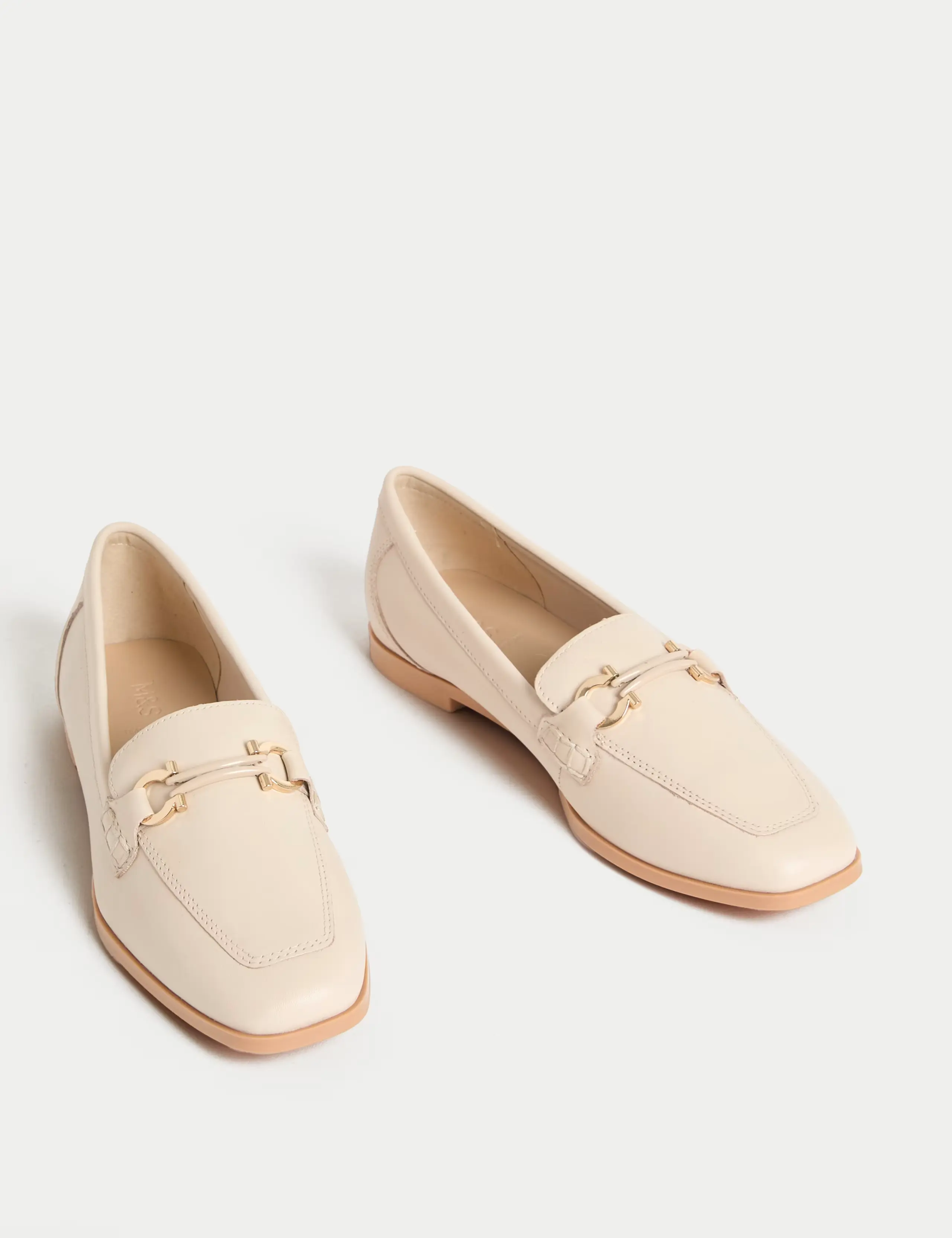 Cream buckle loafers