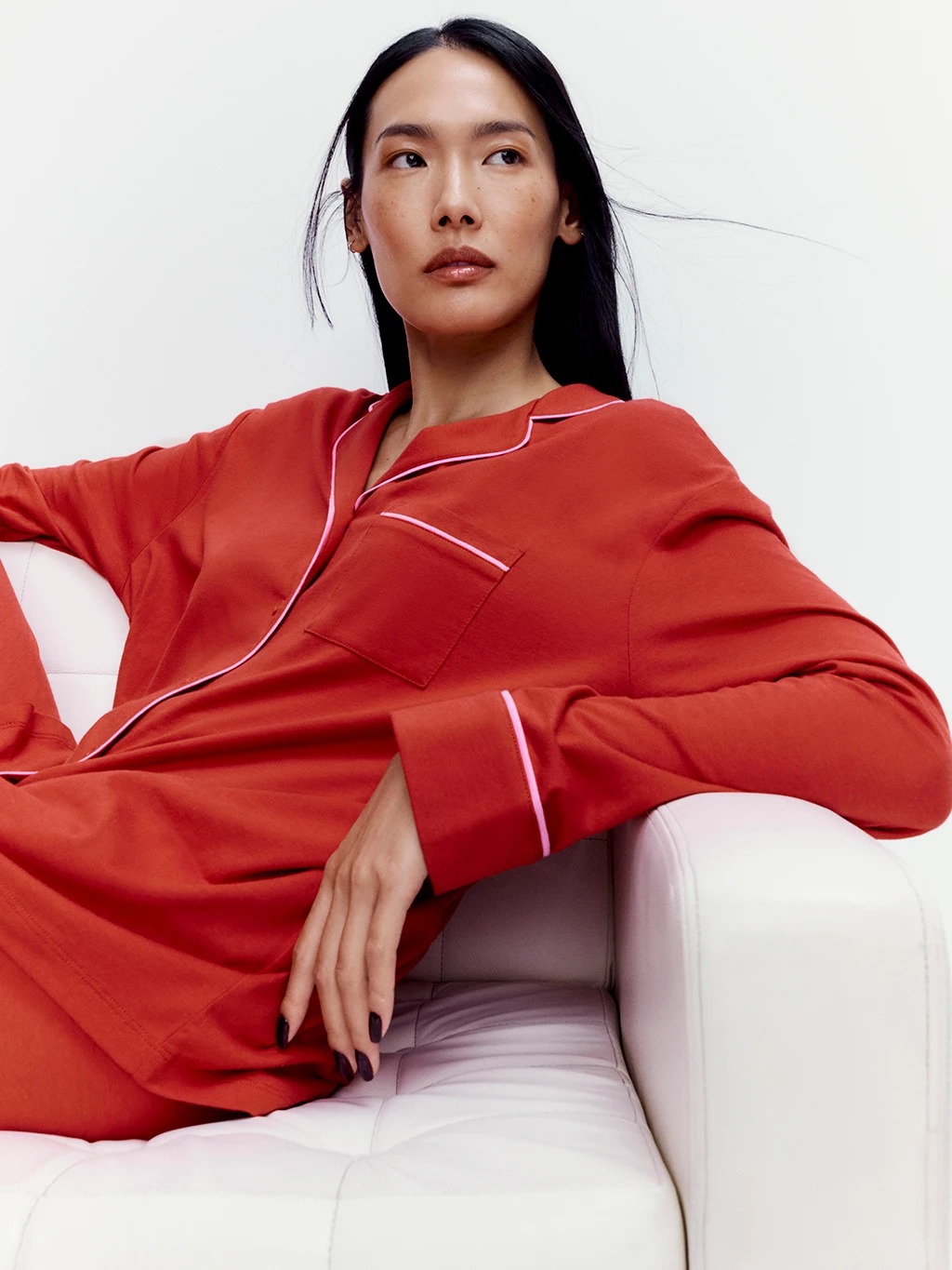 Woman wearing red pyjamas to celebrate Lunar New Year 2025