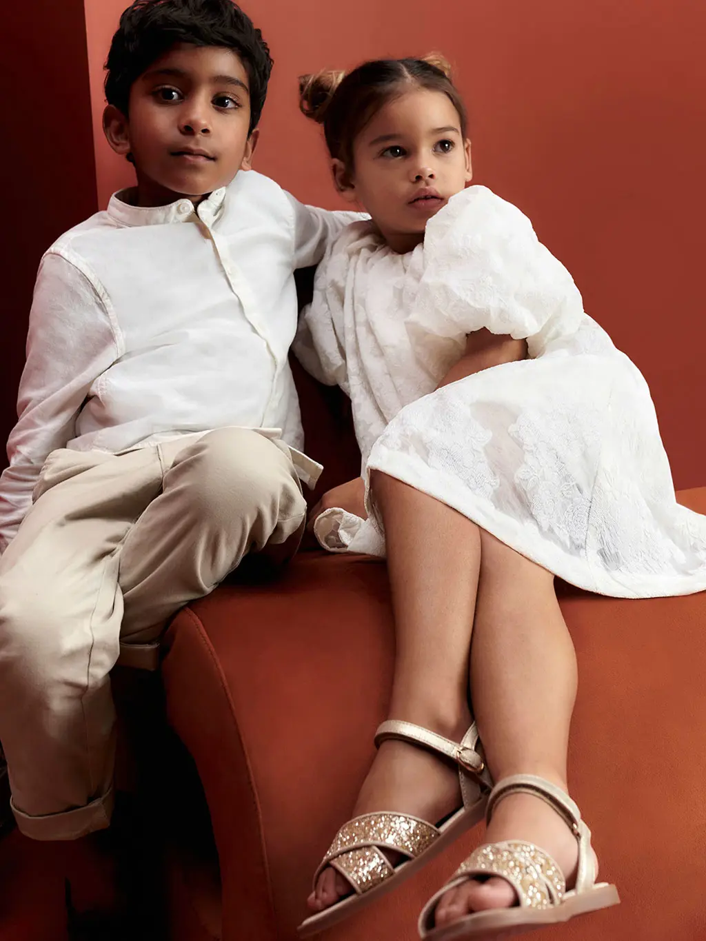 Boy and girl wearing smart clothing