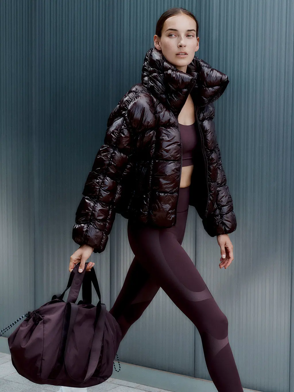 Woman in puffer jacket and leggings