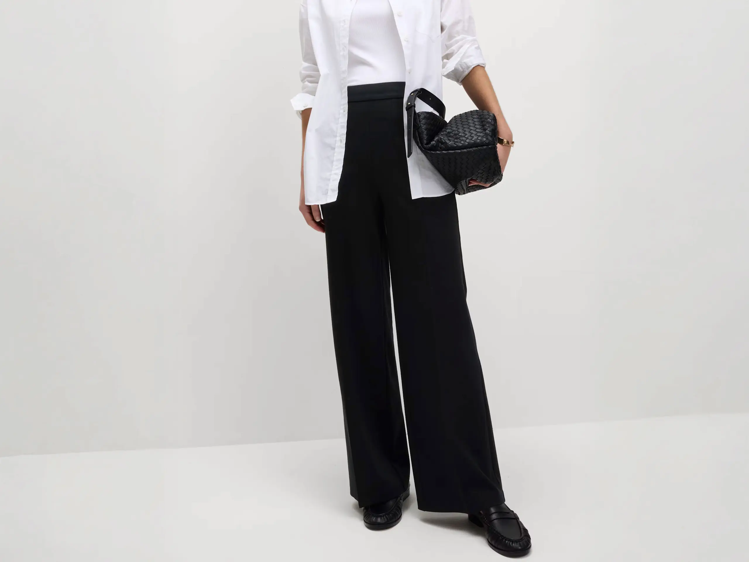 Woman wearing black wide-leg trousers