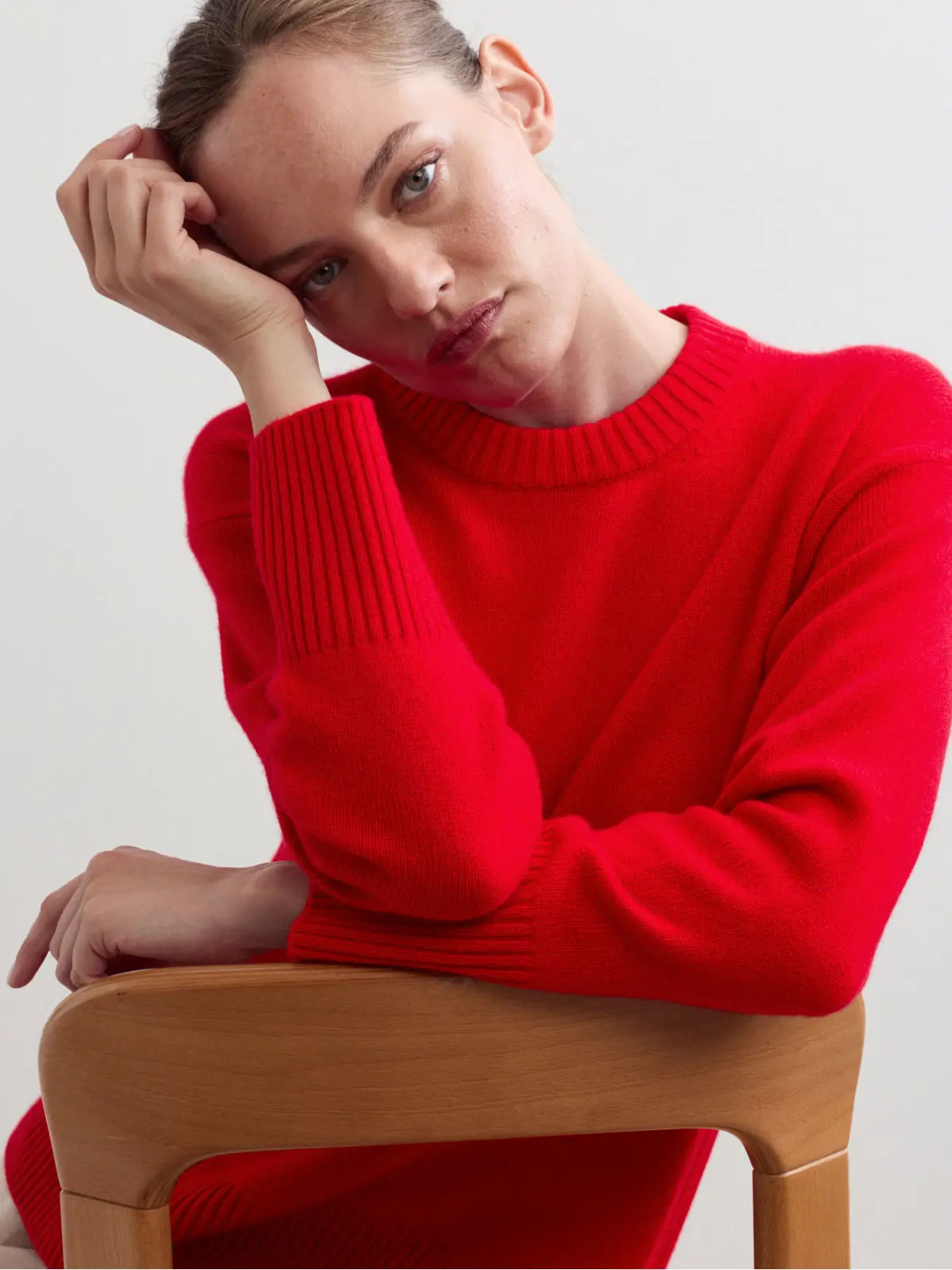Woman wearing red jumper 