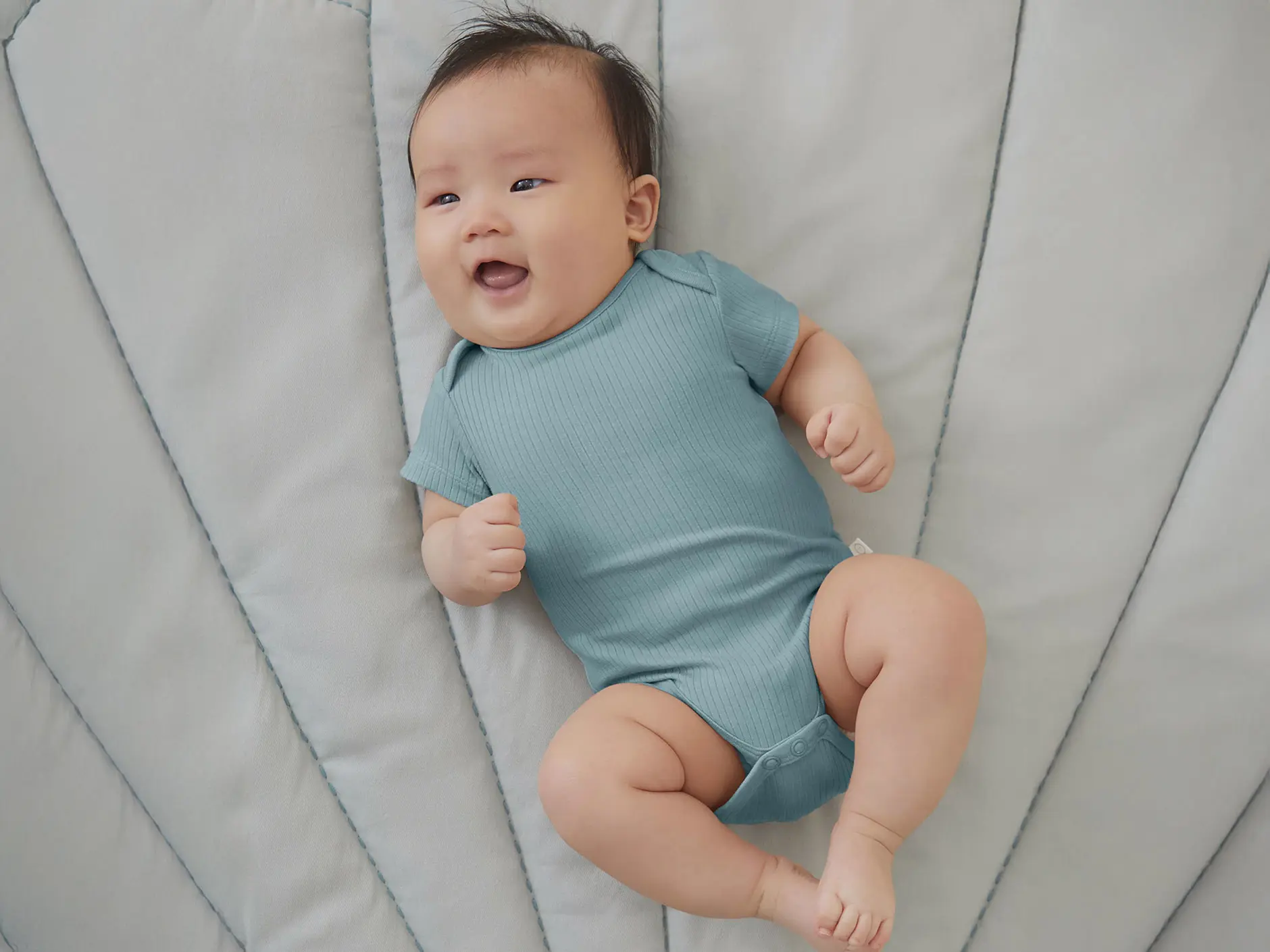 baby wearing ribbed bodysuit