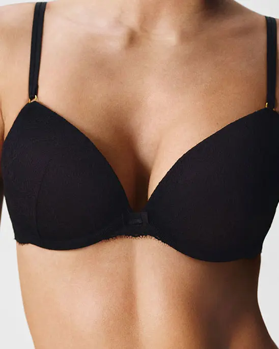 Woman wearing black push-up bra
