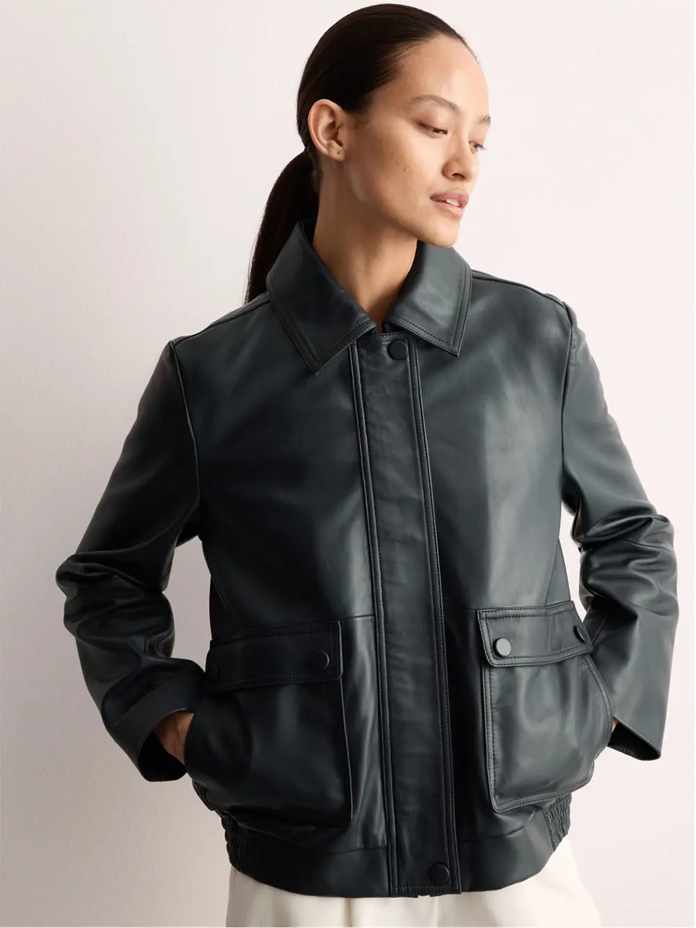 Woman wearing black leather jacket