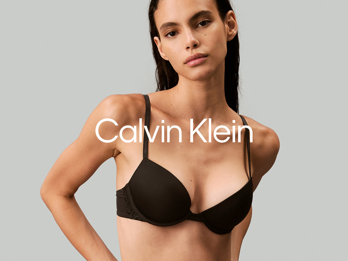 Woman wearing a black Calvin Klein bra