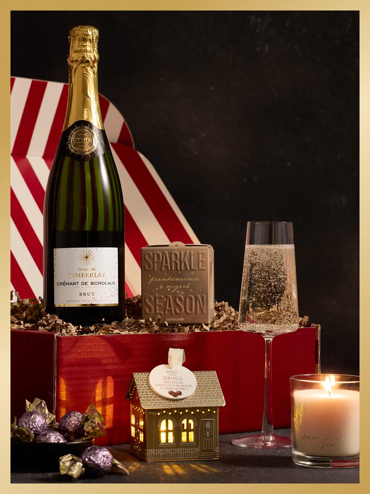 Prosecco, candle and Christmas gifts