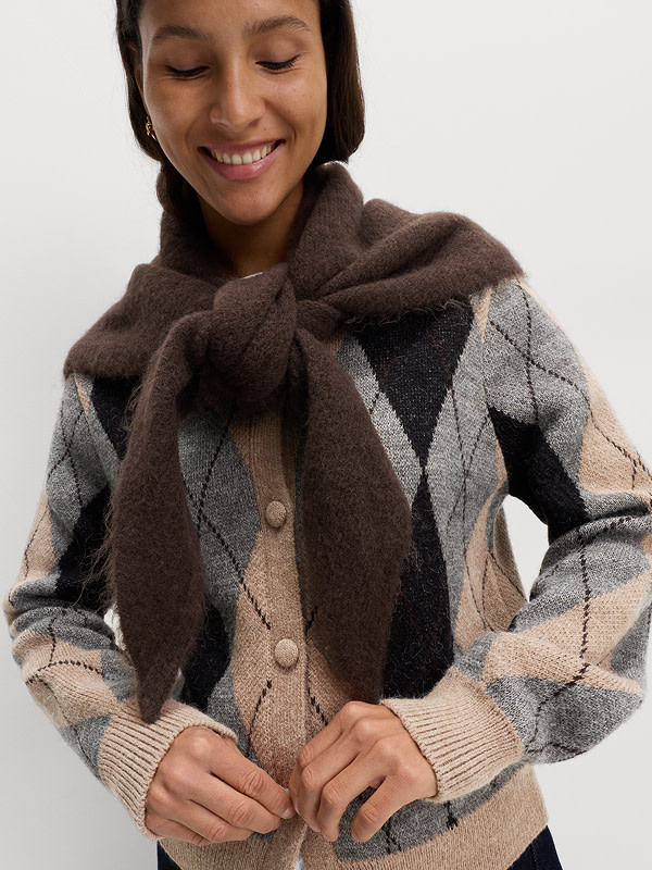 Woman wearing an Argyle crew-neck cardigan