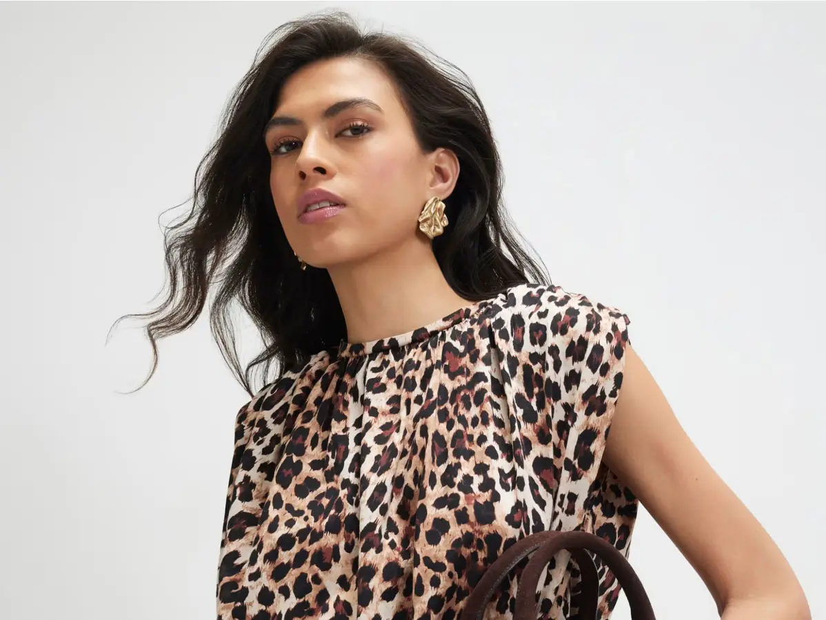 Woman wearing animal print top