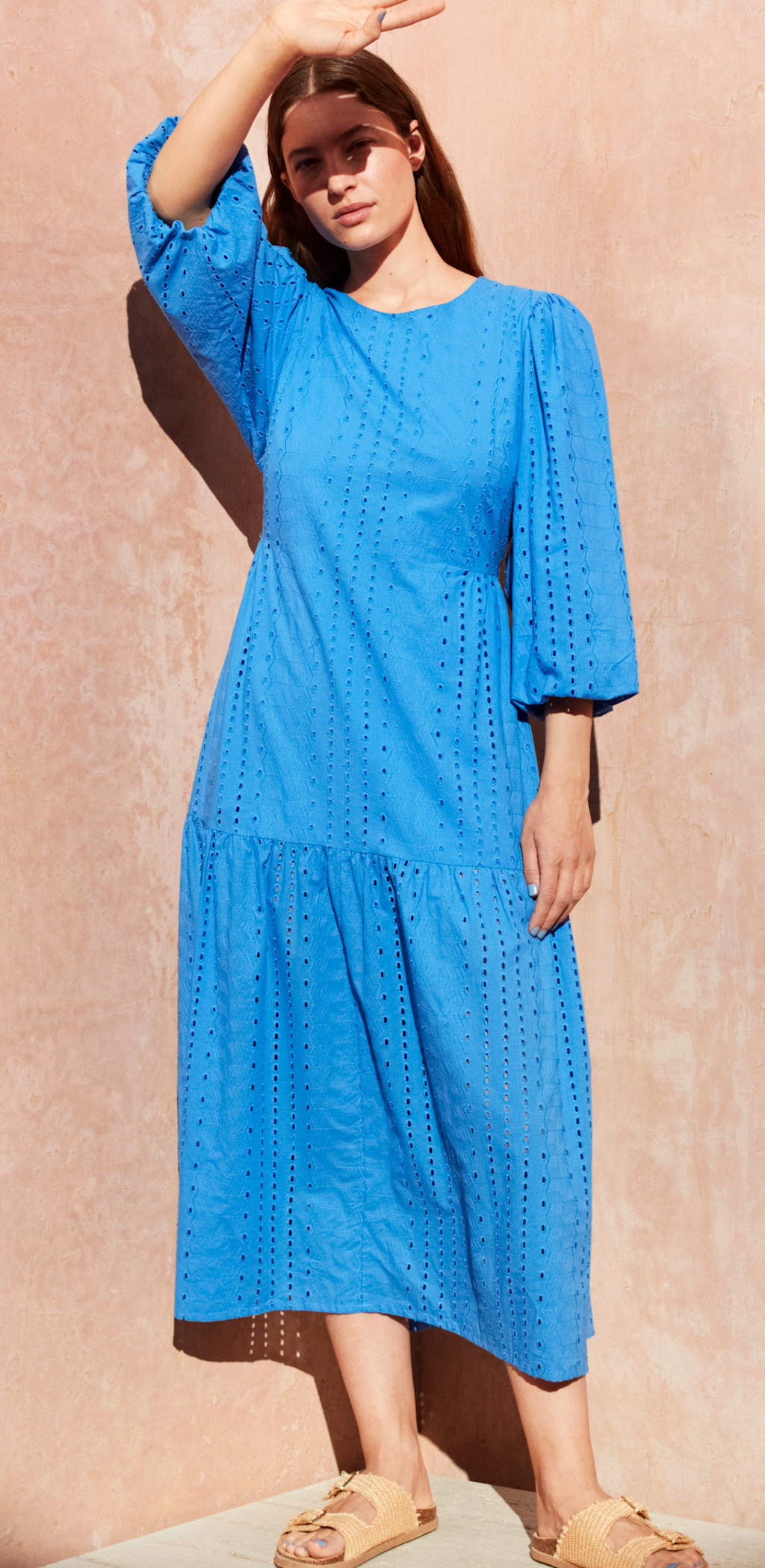 Woman wearing blue midi dress