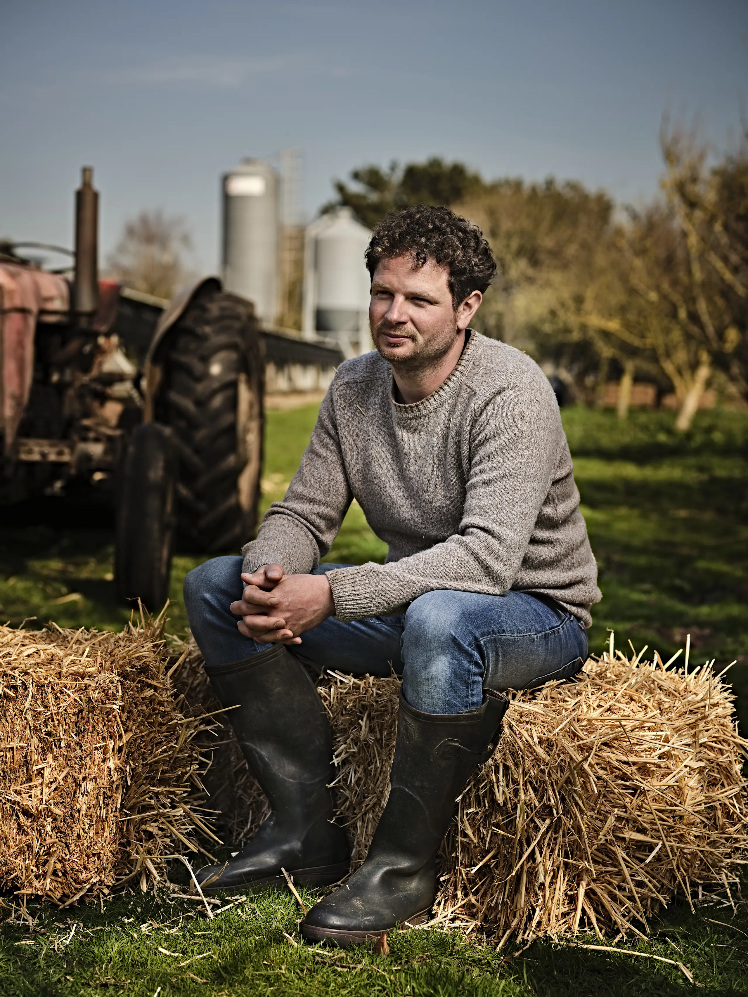 Andy sitting on hay bale