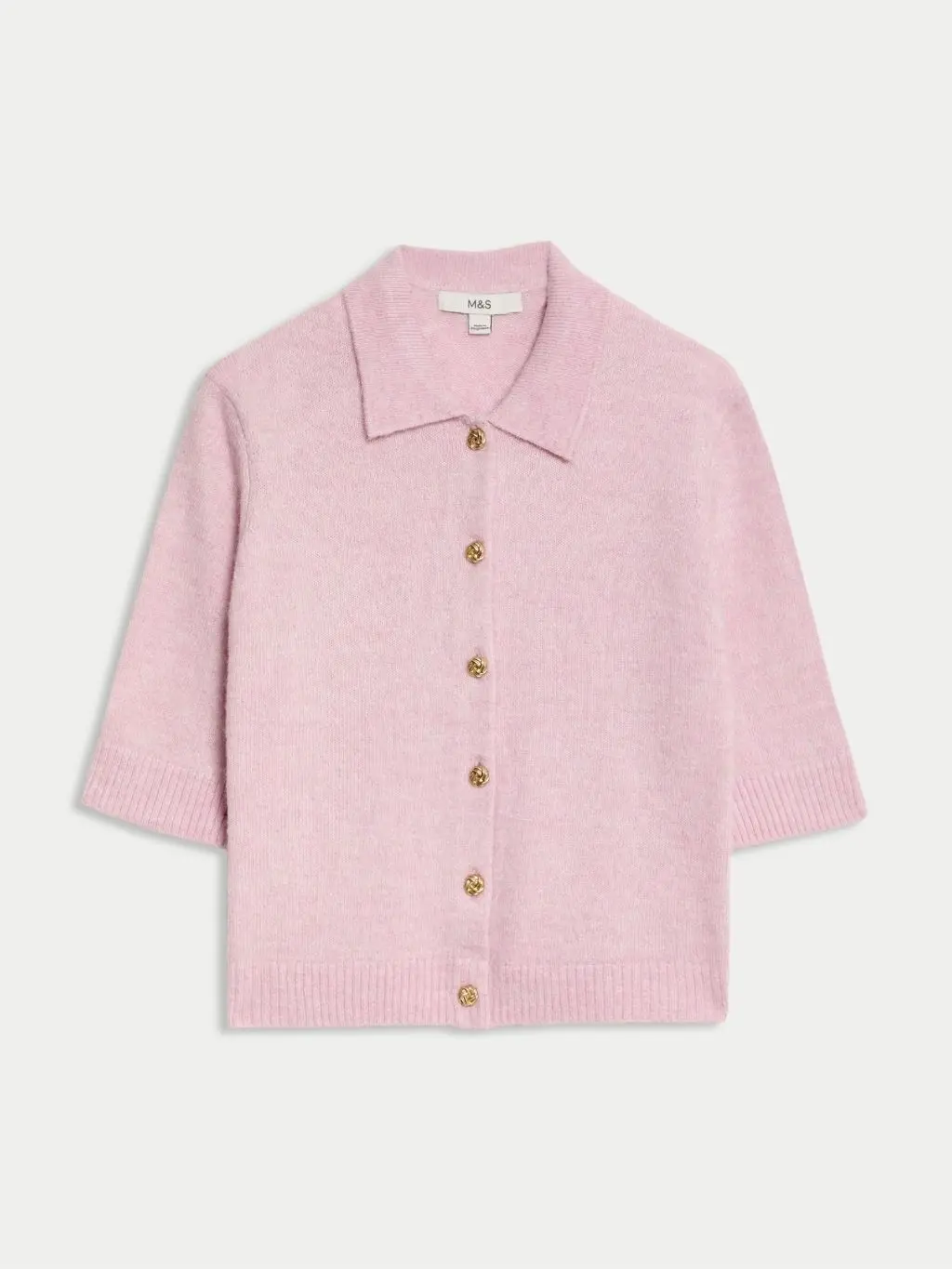 A cutout of a short sleeve pink cardigan by M&S