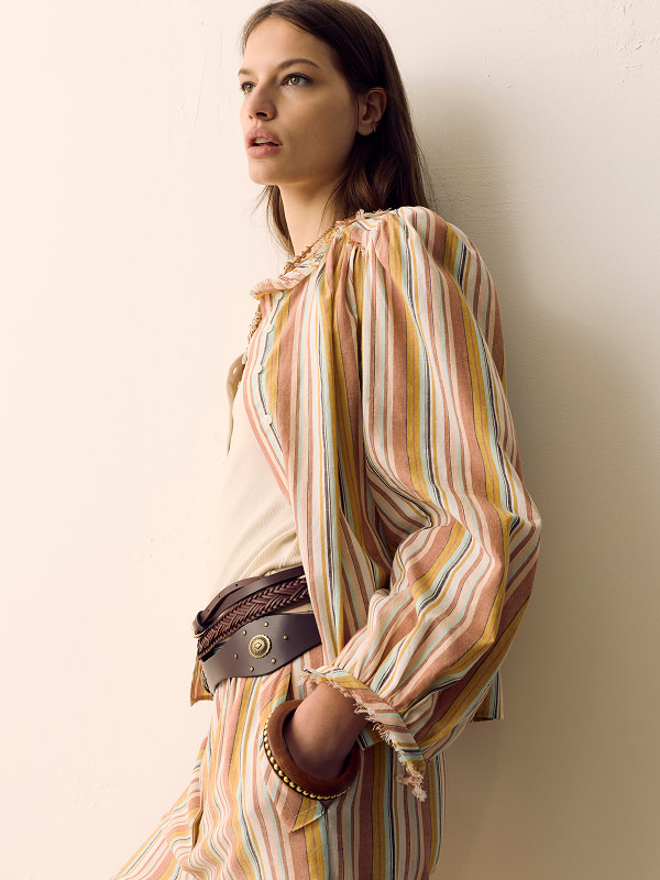 Woman wearing colourful striped co-ord 