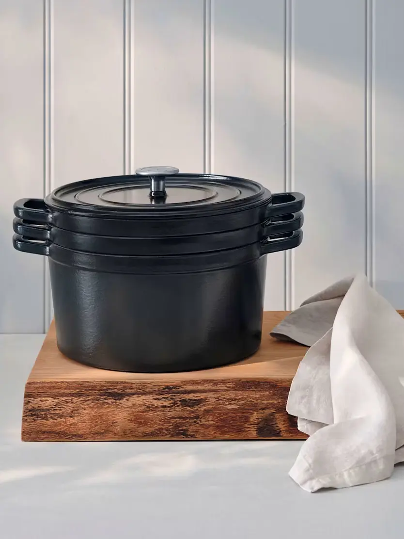 Casserole dish on wooden chopping board