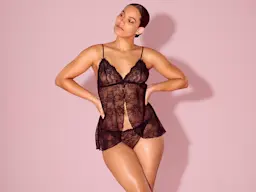 Woman wearing black lace babydoll chemise and matching thong