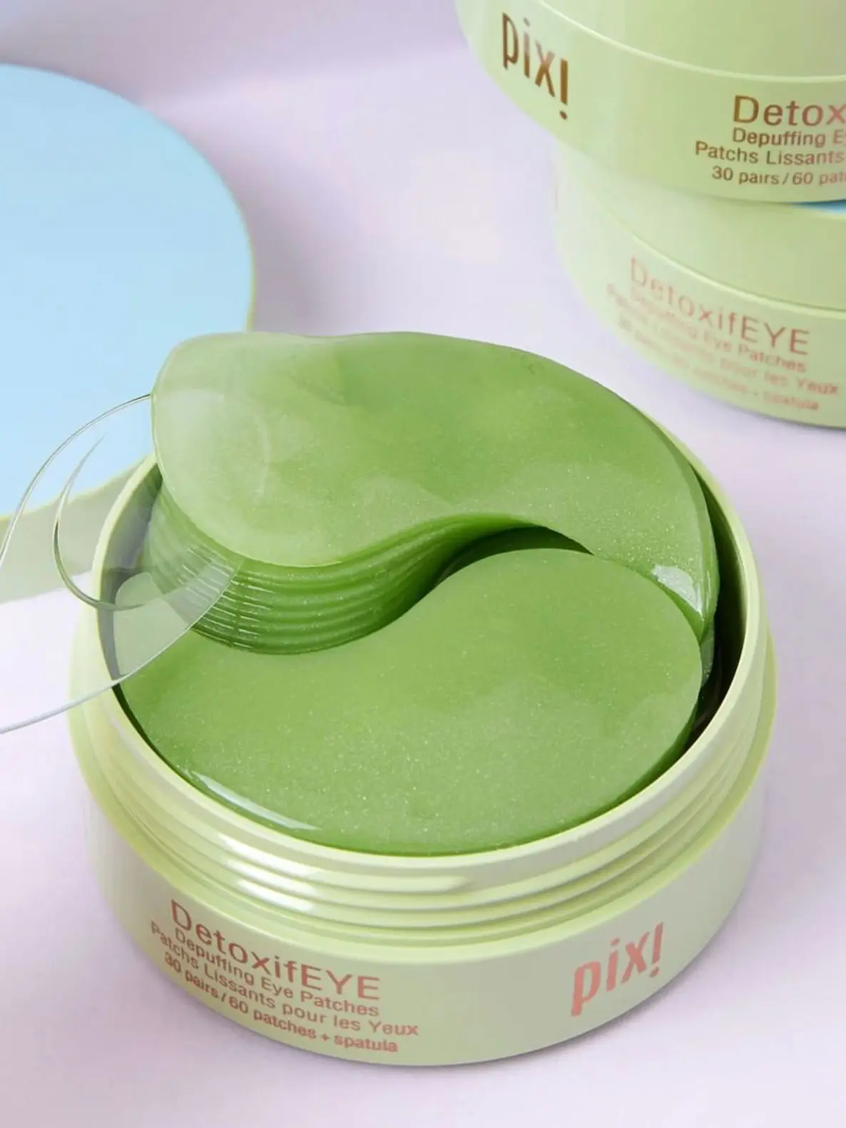 Image of green under-eye patches in green pot