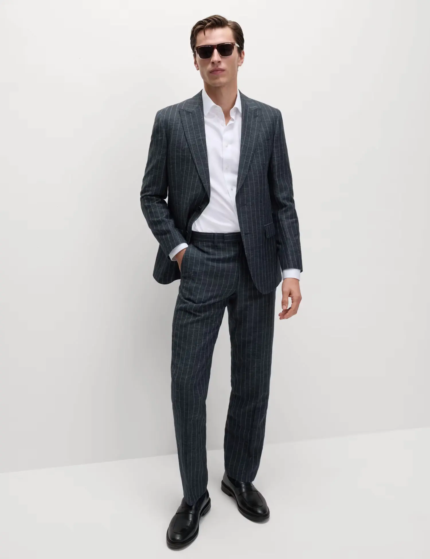 Man wearing grey stripe suit and white shirt at M&S