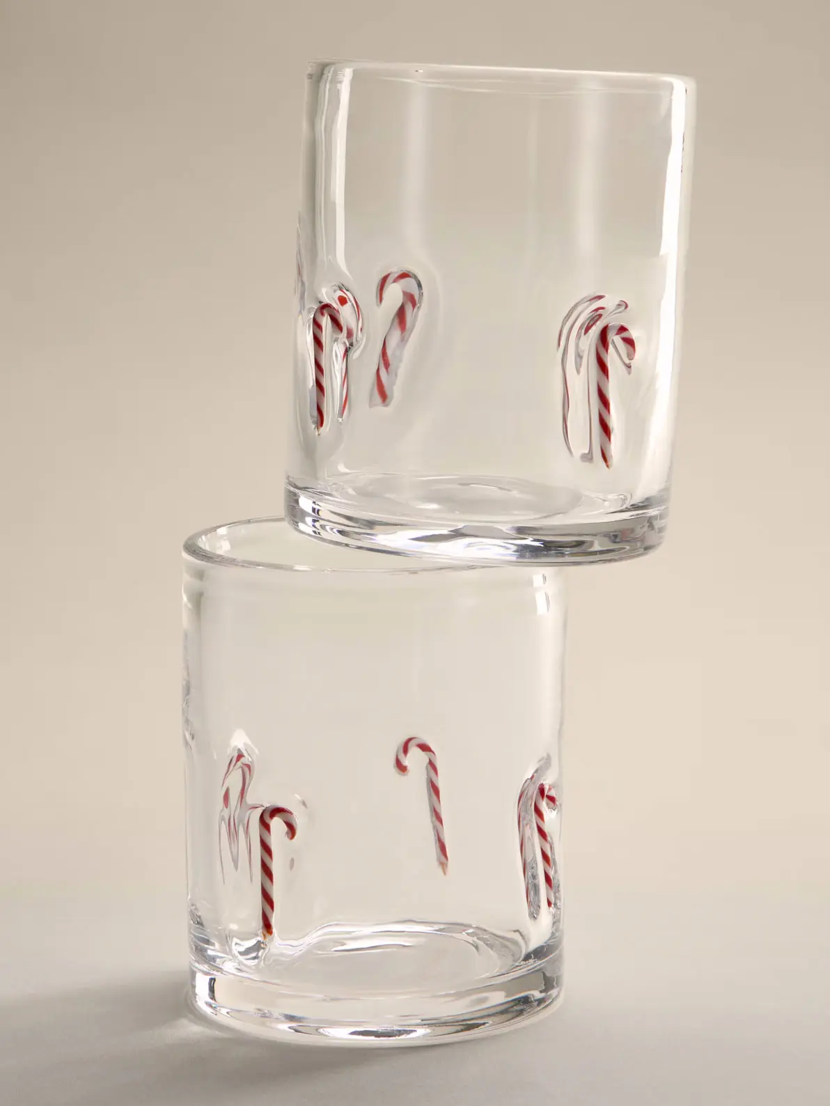 Image of two tumblers with red and white candy cane details