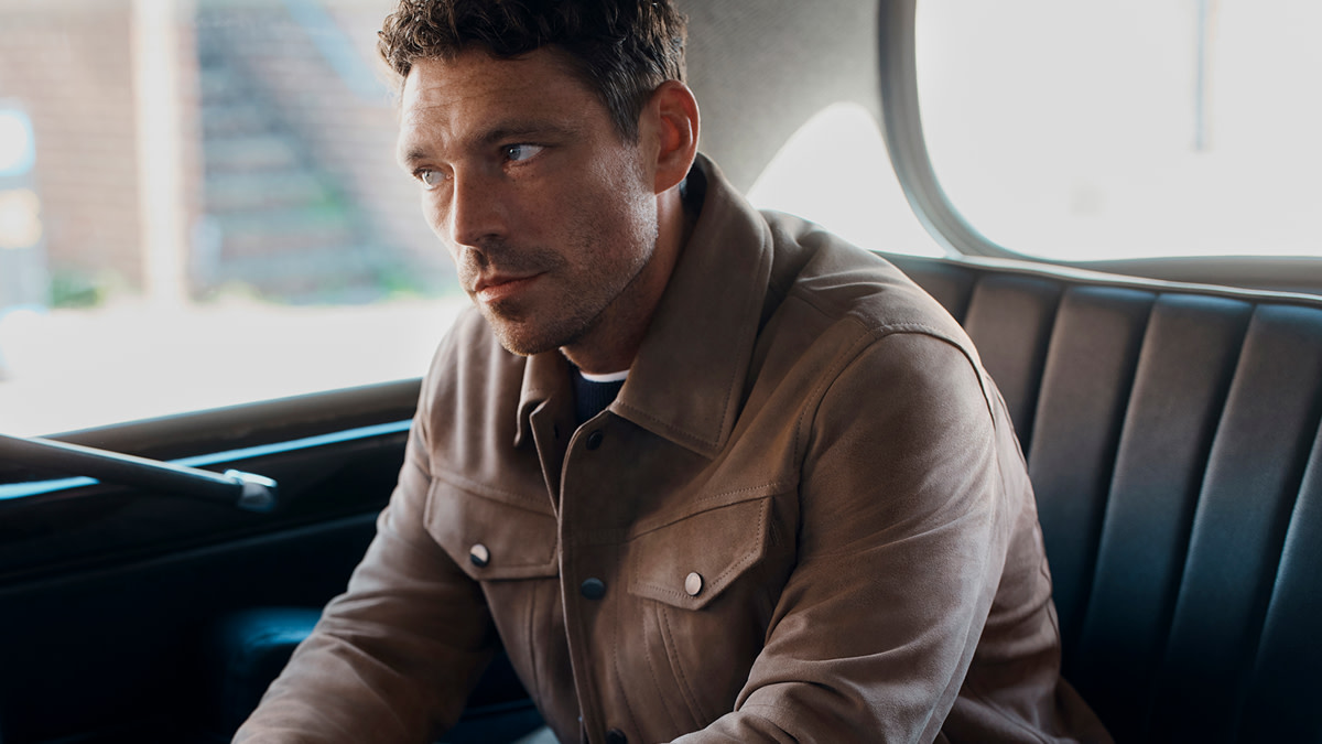 James wearing brown jacket