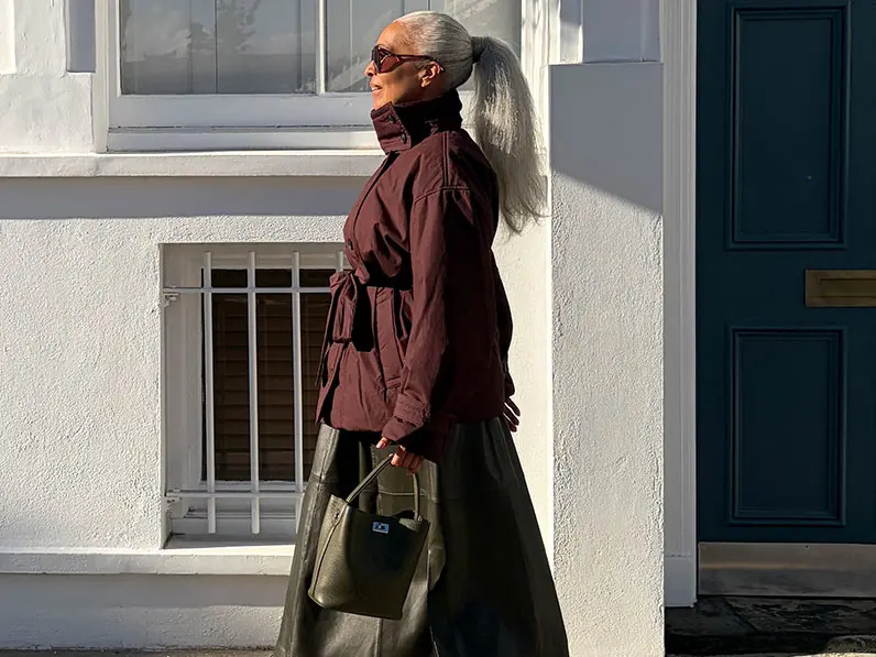 Woman in coat and skirt