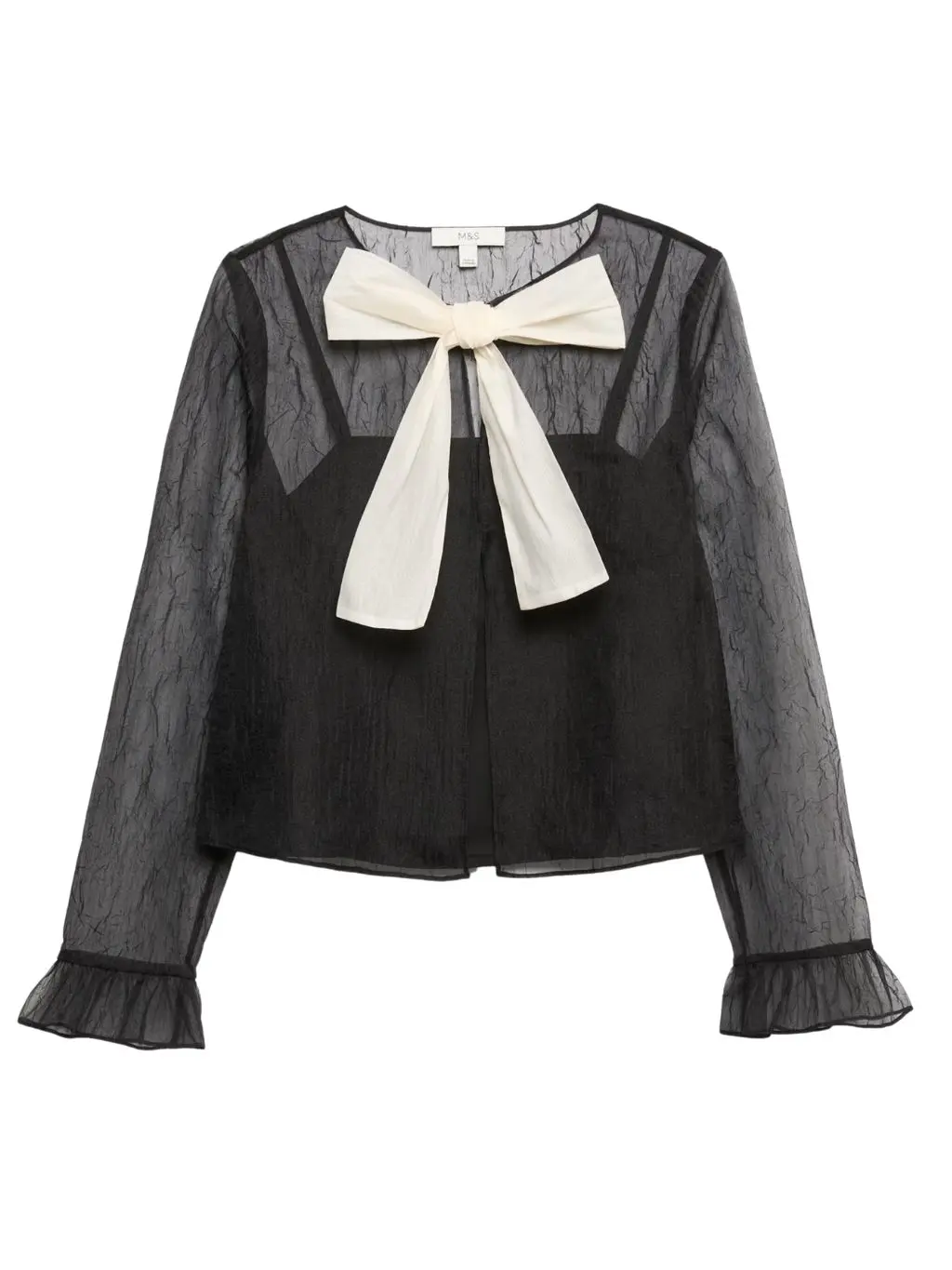 A cutout of a sheer black long sleeve blouse with a cream bow