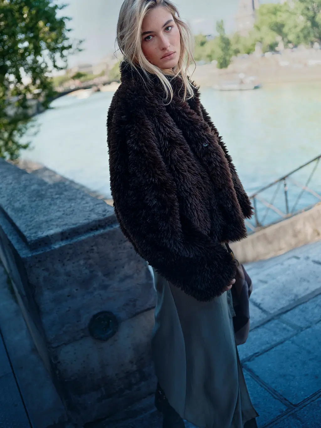 Woman in chocolate brown faux fur jacket