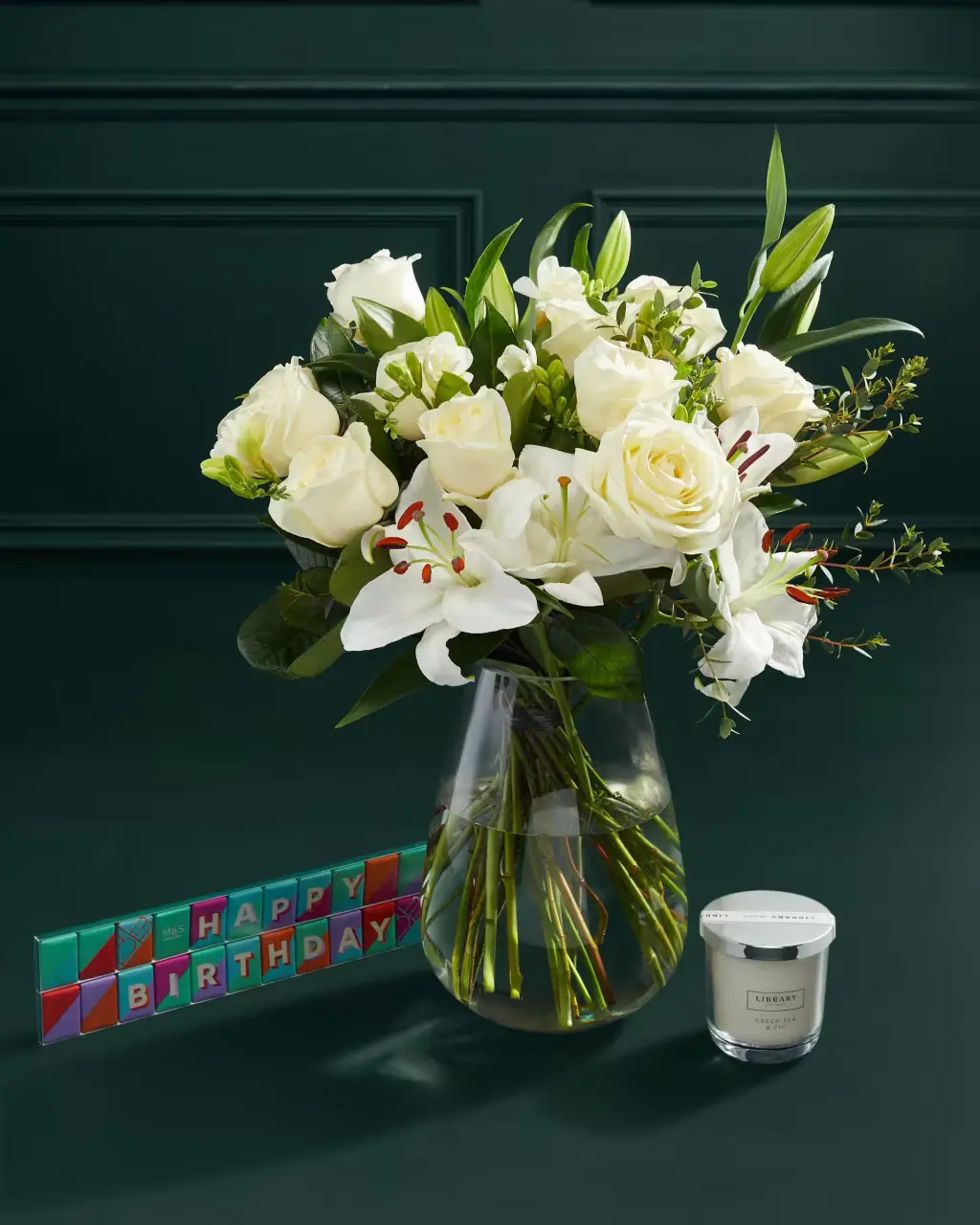 Birthday white rose bouquet with chocolates and candle