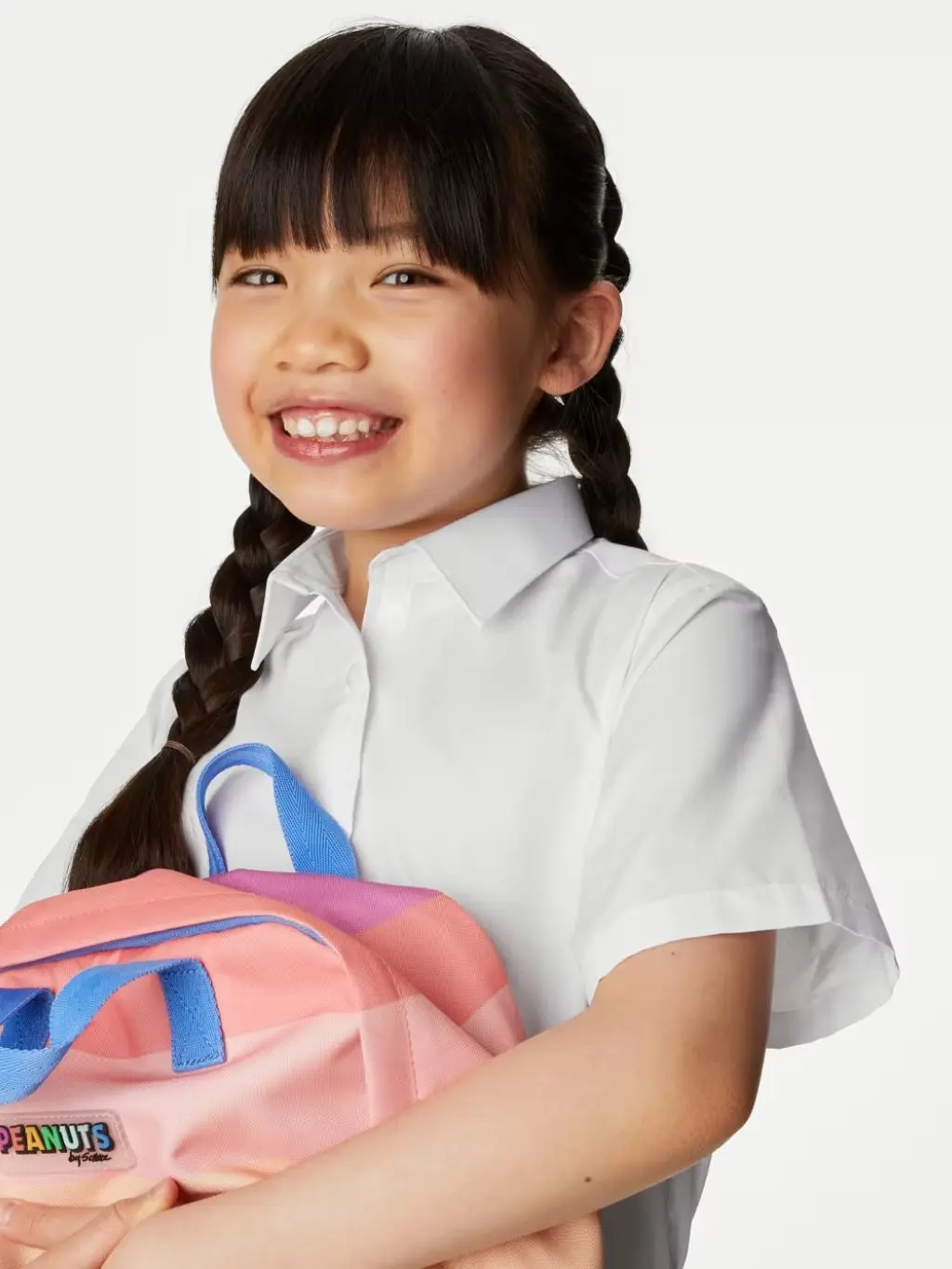 A girl wears an adaptive school uniform