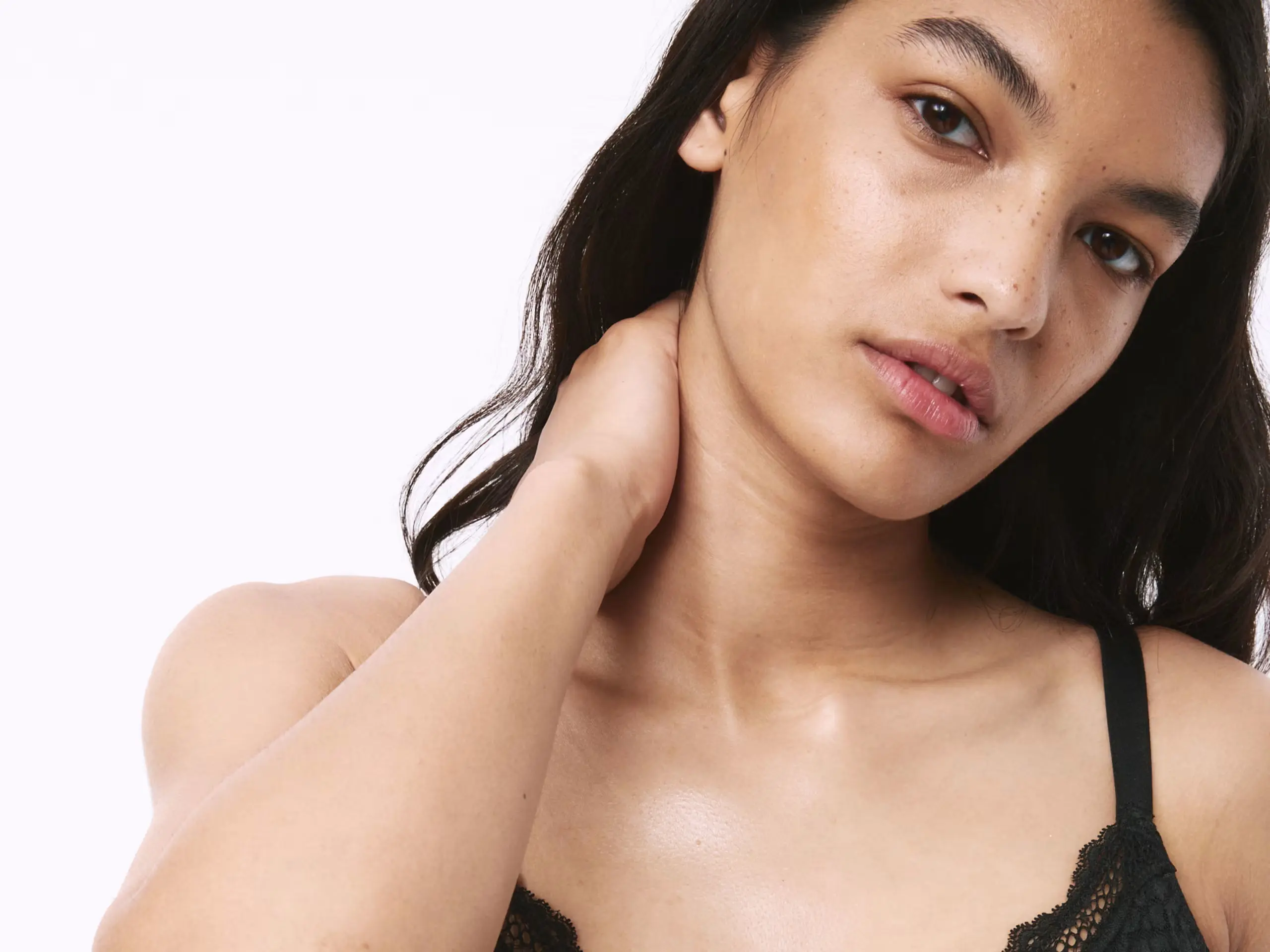 Woman wearing black minimiser bra at M&S