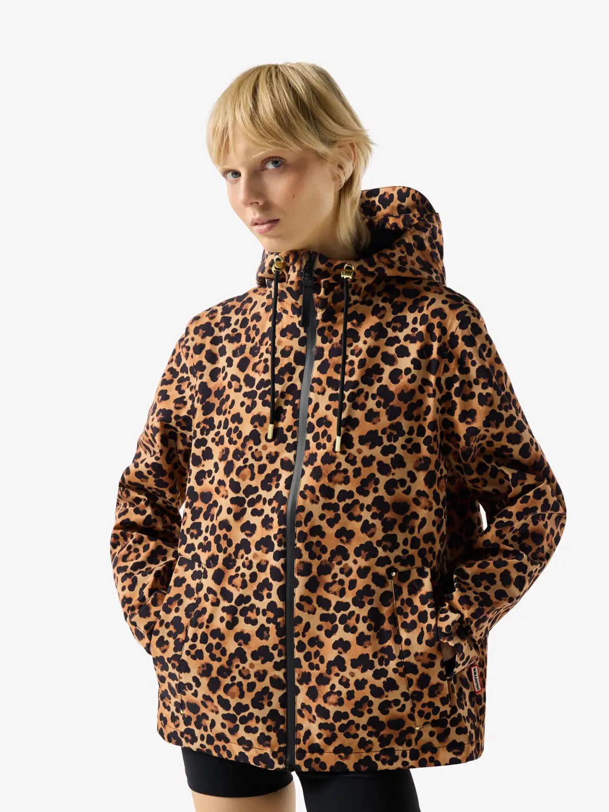 Woman wearing animal-print jacket and biker shorts 