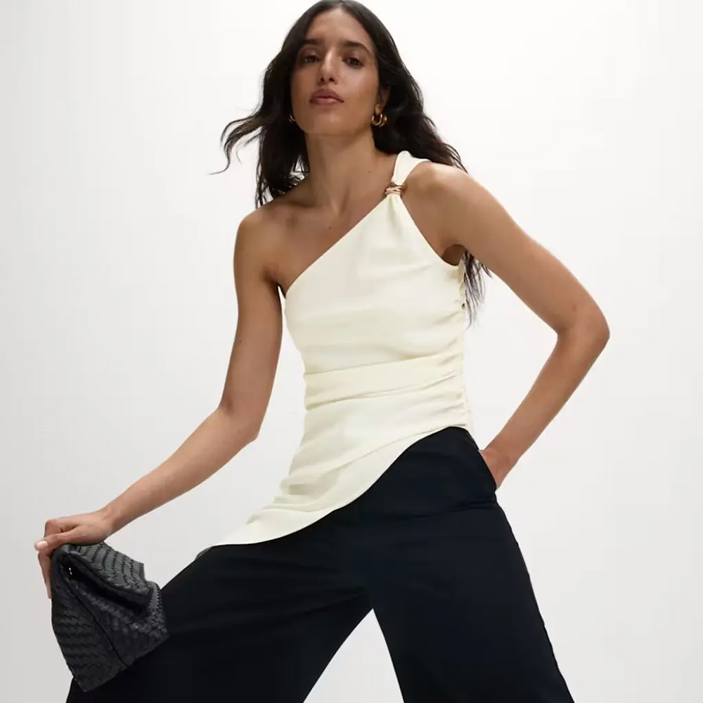 Woman wearing cream asymmetric top