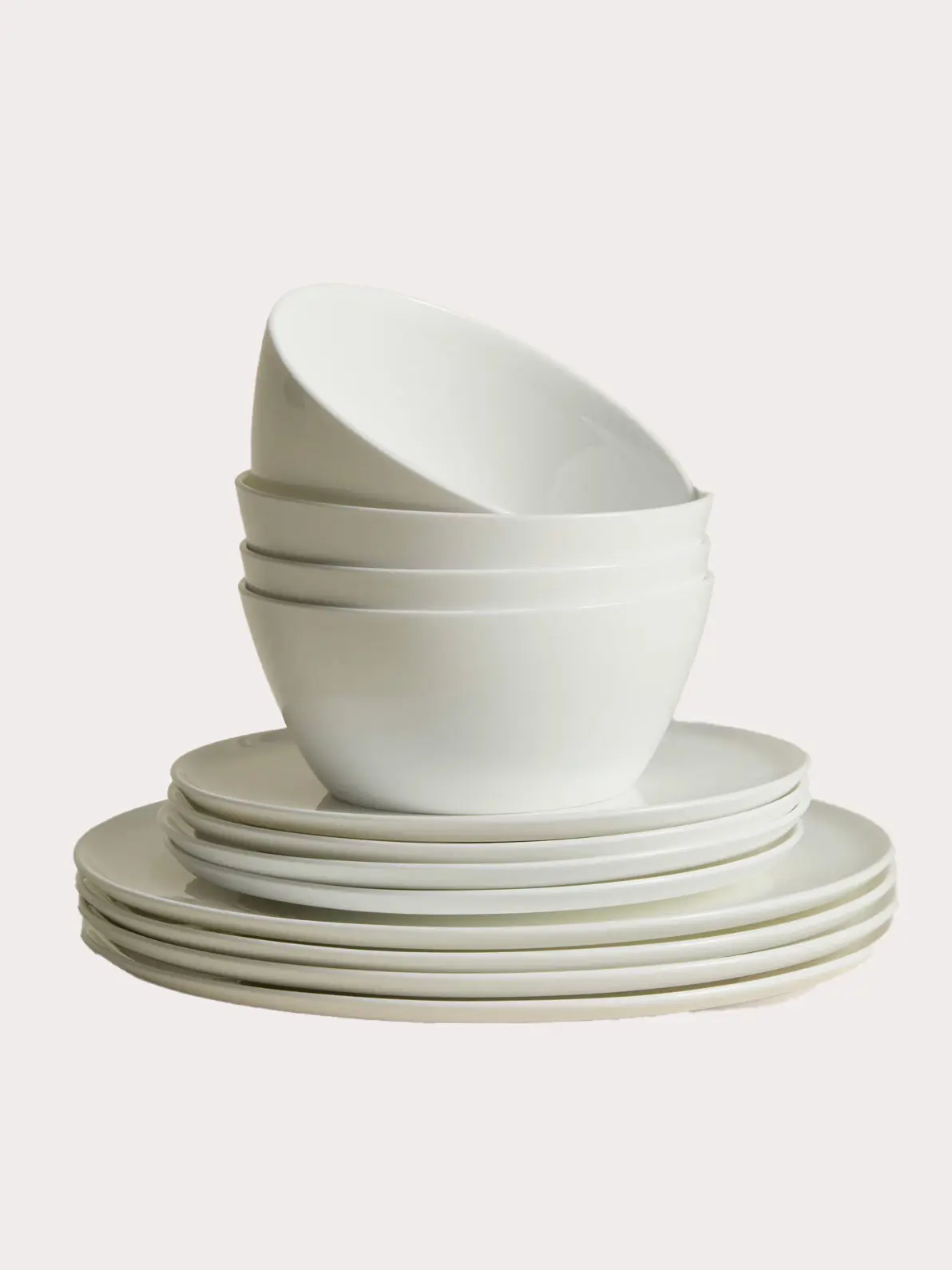 Pile of white plates and bowls