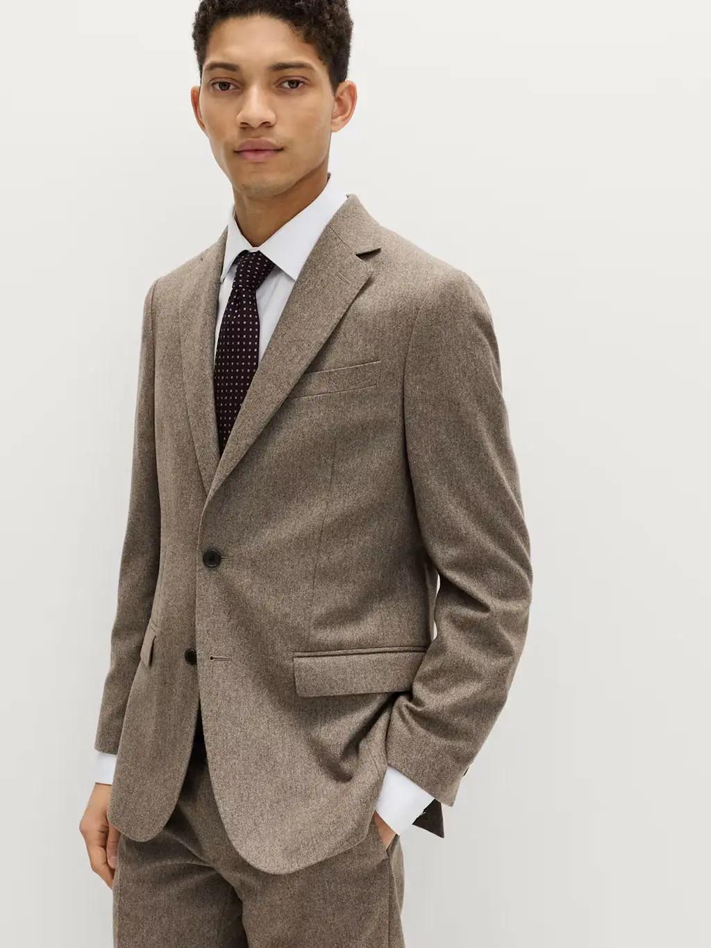 Man in brown tweed suit