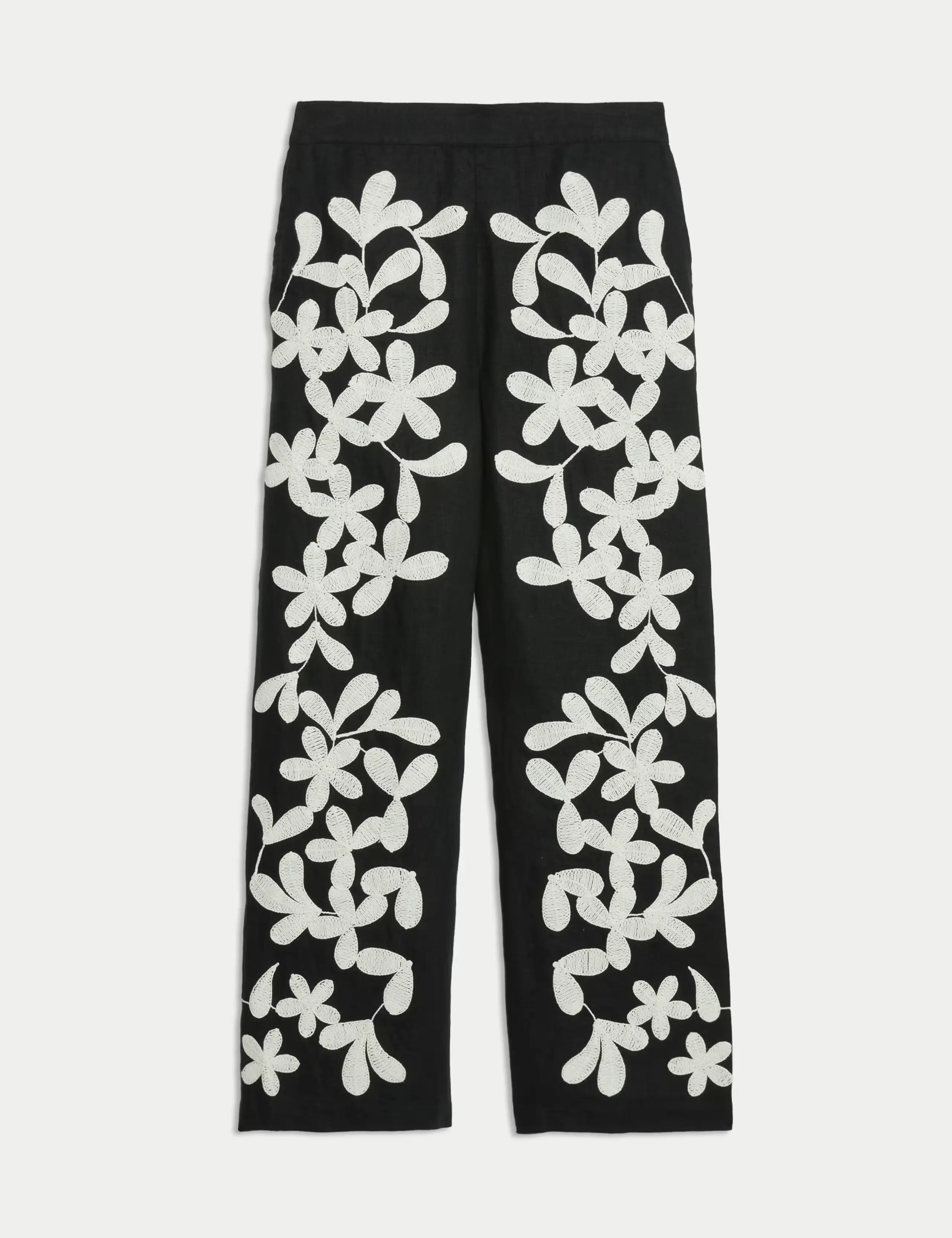 Black trousers with white embroidery